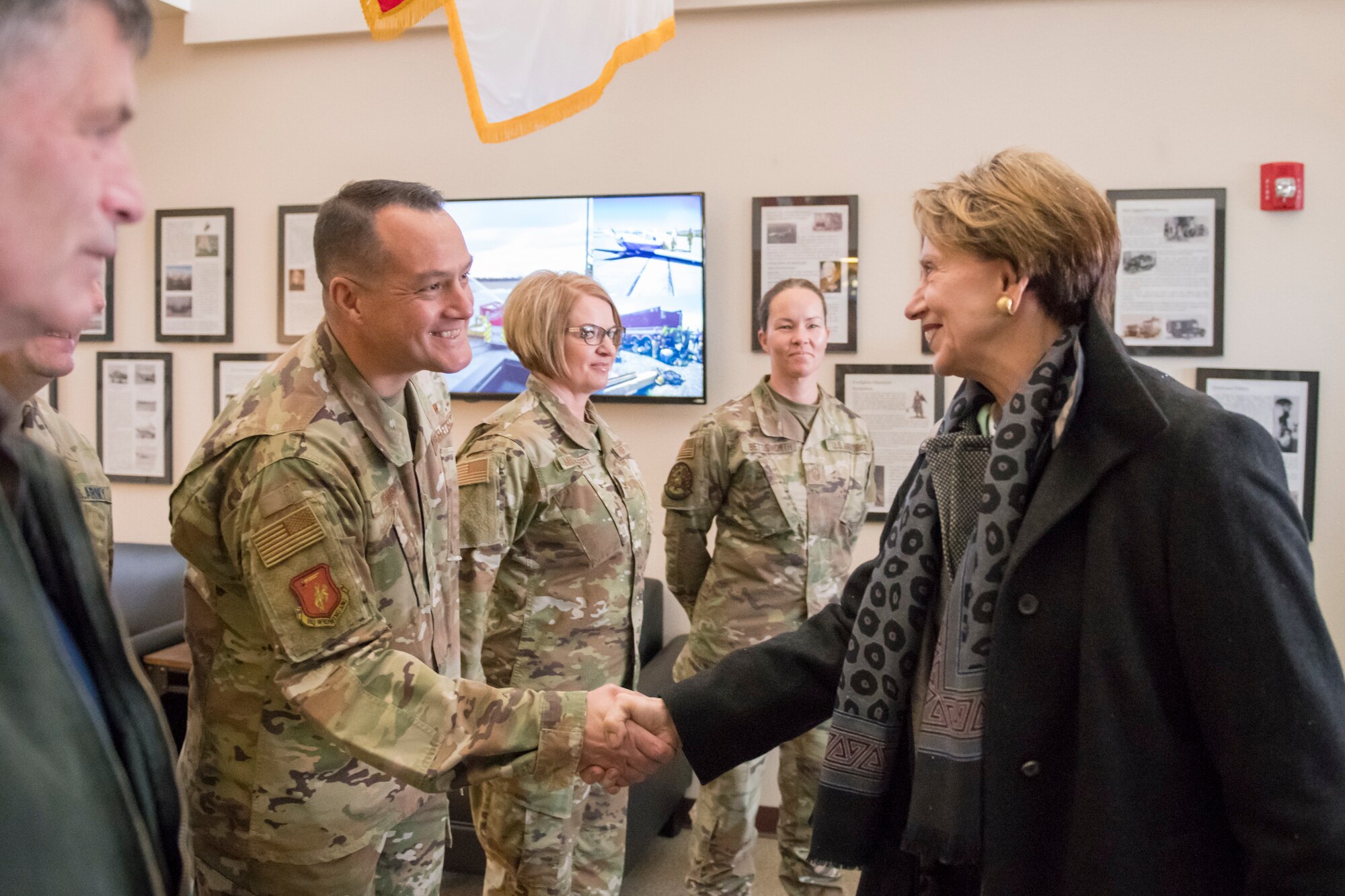 U.S. Air Force Chief Master Sgt. Joshua Moore, state command chief, Wyoming National Guard, greets Secretary of the Air Force Barbara Barrett at the 153d Airlift Wing, Wyoming Air National Guard Base, Cheyenne, Wyo., Oct. 27, 2019. This visit marks Barrett's first official visit since becoming the SECAF.