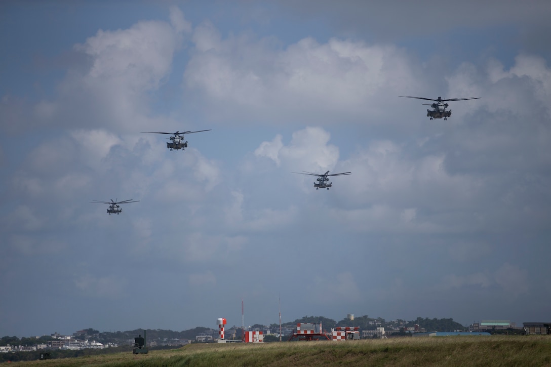 Four CH-53E Super Stallion with Marine Heavy Helicopter Squadron 462 depart from MCAS Futenma. Marine Aircraft Group 36 conduct a rapid deployment exercise on Oct. 23, 2019 in Okinawa, Japan and the Indo-Pacific region. This type of realistic training is used to highlight an active posture of a ready force and is essential to maintaining the readiness needed to uphold our commitments to our allies and surrounding nations. (U.S. Marine Corps photo by Lance Cpl. Madeline Jones)