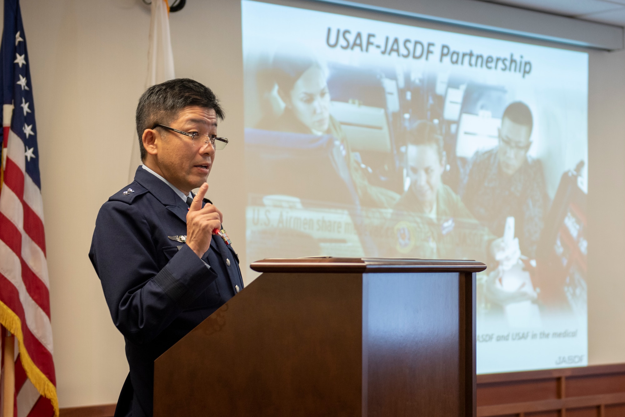 Japanese Air Self-Defense Force Maj. Gen. Shinya Bekku, JASDF Surgeon General, address a room full of Headquarters Pacific Air Forces and the 374th Medical Group leadership about the ongoing partnership between the two nation’s medical teams at Yokota Air Base, Japan, Oct. 28, 2019.