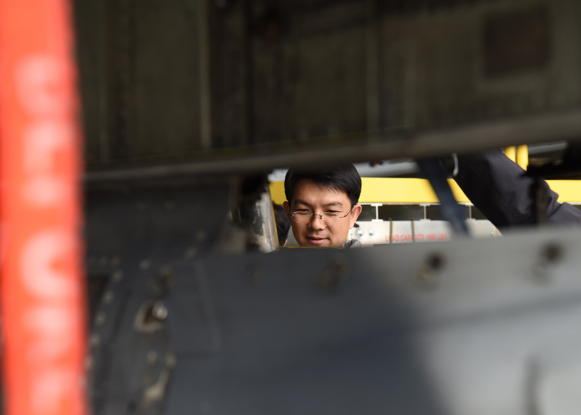 A member of the Republic of Korea Air Force legal team looks at an A-10 Thunderbolt II assigned to the 25th Fighter Squadron at Osan Air Base, ROK, during a Friendship Day with U.S. Air Force legal teams from Osan and Kunsan Air Bases, ROK, October 23, 2019. The purpose of the day was to give both counterparts the opportunity to spend time together and strengthen the ties between the two nations. (U.S. Air Force photo by Senior Airman Denise M. Jenson)