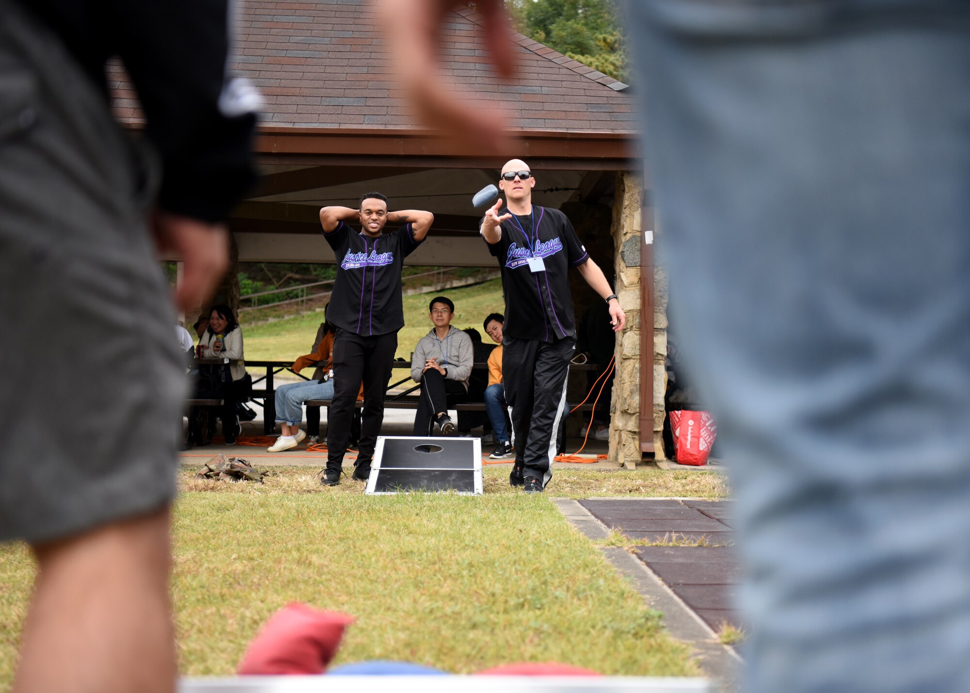 Members of the U.S. and Republic of Korea Air Forces legal teams play a game of cornhole during a Friendship Day at Osan Air Base, ROK, October 23, 2019. The purpose of the day was to give both counterparts the opportunity to spend time together and strengthen the ties between the two nations. (U.S. Air Force photo by Senior Airman Denise M. Jenson)