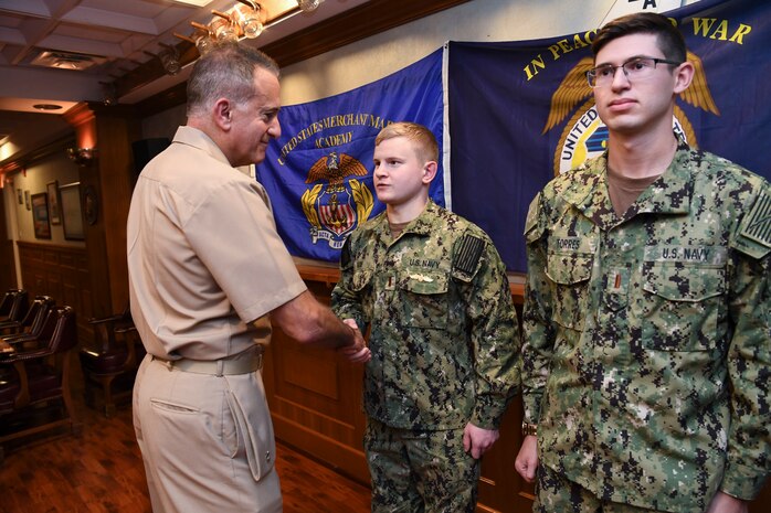 191023-N-KZ419-1035 NAVAL SUPPORT ACTIVITY BAHRAIN, Bahrain (Oct. 23, 2019) Rear Adm. Jack Buono, Superintendent of the U.S. Merchant Marine Academy, pins Ensign Daniel May with his Strategic Sealift Officer Warfare Insignia during after a tour of the Naval Coordination and Guidance for Shipping (NCAGS) facilities. The U.S. Naval Forces Central Command (NAVCENT) NCAGS team has recently amplified their support to the region in support of Operation Sentinel, a multinational maritime security effort designed to increase surveillance of key waterways in the Middle East to ensure freedom of navigation. (U.S. Navy photo by Mass Communication Specialist 3rd Class Dawson Roth/Released)