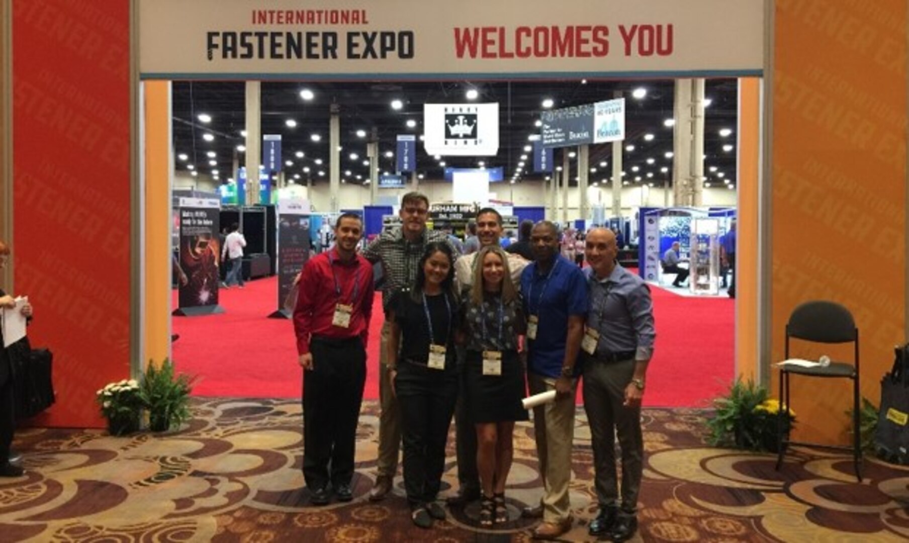 DLA Troop Support Industrial Hardware employees pose for a photo Sept. 29, 2019 at the entrance to the International Fastener Expo in Las Vegas, Nevada.