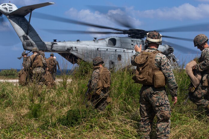 U.S. Marines with Marine Wing Support Squadron 172, 1st Marine Aircraft Wing, III Marine Expeditionary Force board a CH-53E Super Stallion helicopter during a rapid deployment exercise conducted by 1st MAW, Okinawa, Japan, Oct. 25, 2019. Marines with 1st MAW conducted a rapid deployment exercise to increase the confidence of III MEF’s ability to rapidly deploy and maintain a secure Indo-Pacific region. As the only forward-deployed MEF, III MEF is strategically postured to quickly and effectively respond to any crisis within the Indo-Pacific region.