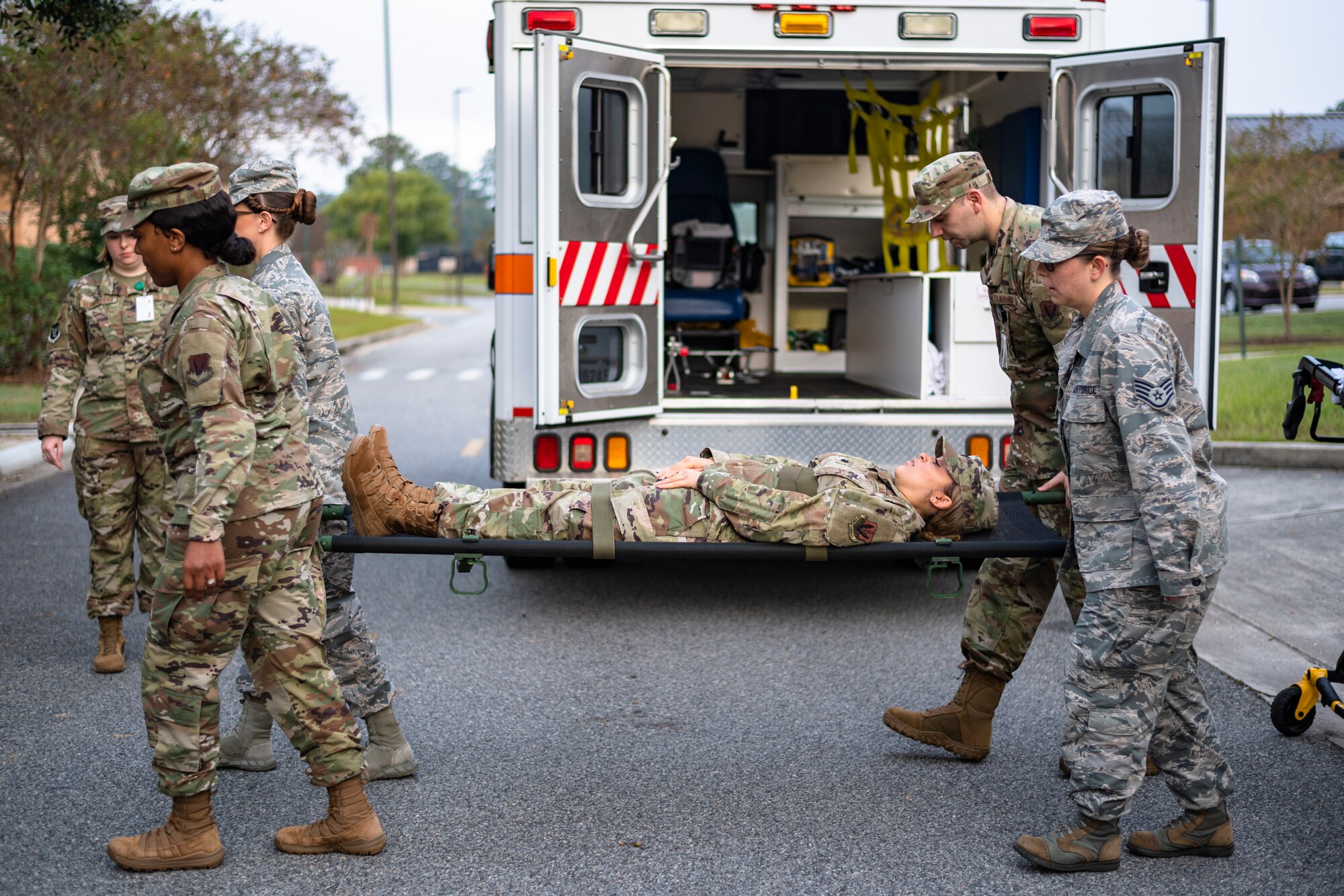 Airmen with the 23d Medical Group practice horizontal litter-carry movements during training Oct. 25, 2019, at Moody Air Force Base, Ga. The 23d MDG conducted the training in preparation for the upcoming Thunder Over South Georgia Open House. Airmen practiced litter-carry movements and commands to ensure they have the appropriate skills in the case of an emergency. (U.S. Air Force photo by Airman 1st Class Taryn Butler)