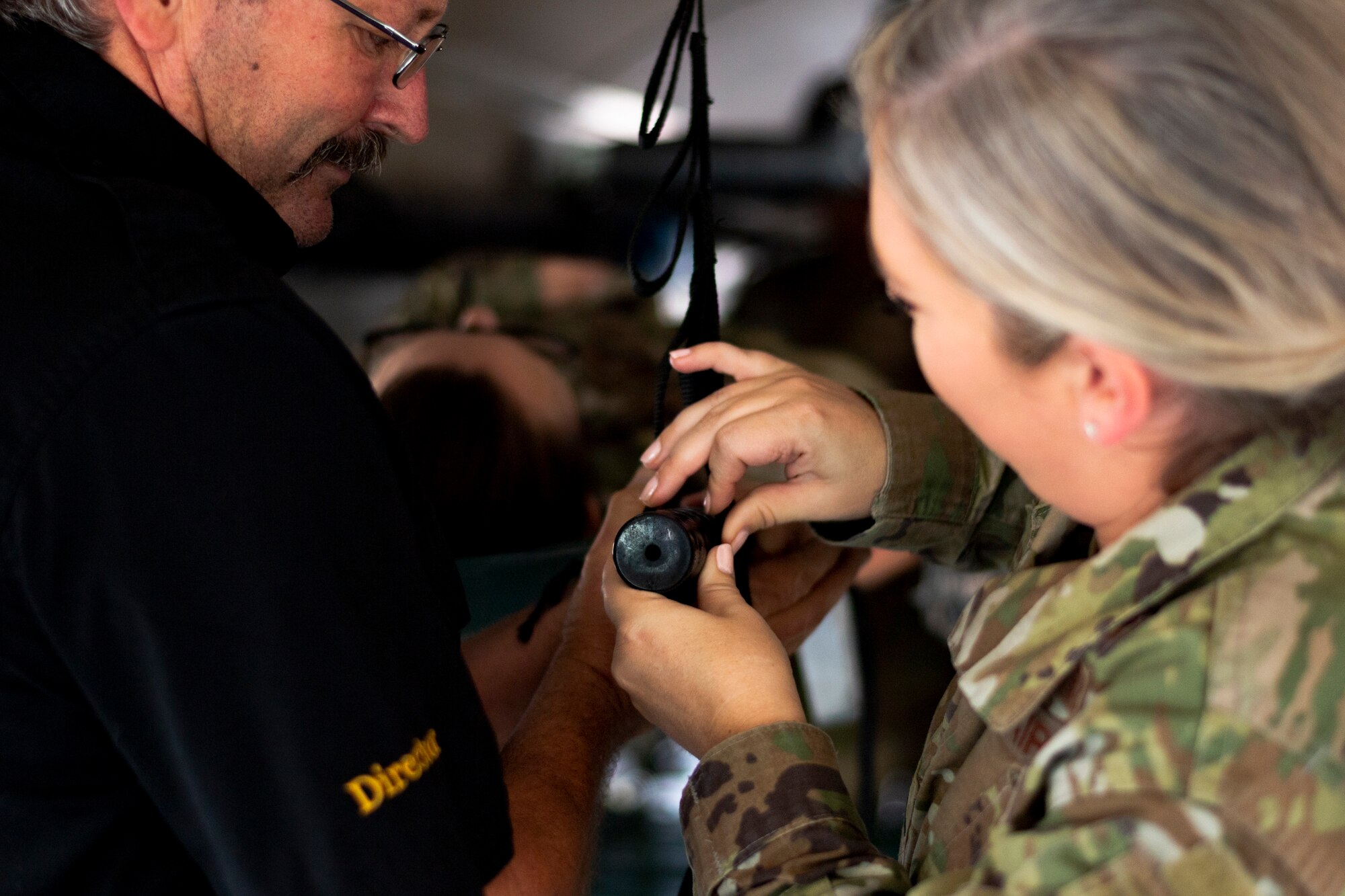 1st Lt. Lauren Shuman, right, 23d Medical Support Squadron resource management flight commander, secures a litter in an ambulance bus during litter-carry training Oct. 25, 2019, at Moody Air Force Base, Ga. The 23d Medical Group conducted the training in preparation for the upcoming Thunder Over South Georgia Open House. Airmen practiced litter-carry movements and commands to ensure they have the appropriate skills in the case of an emergency. (U.S. Air Force photo by Airman 1st Class Taryn Butler)