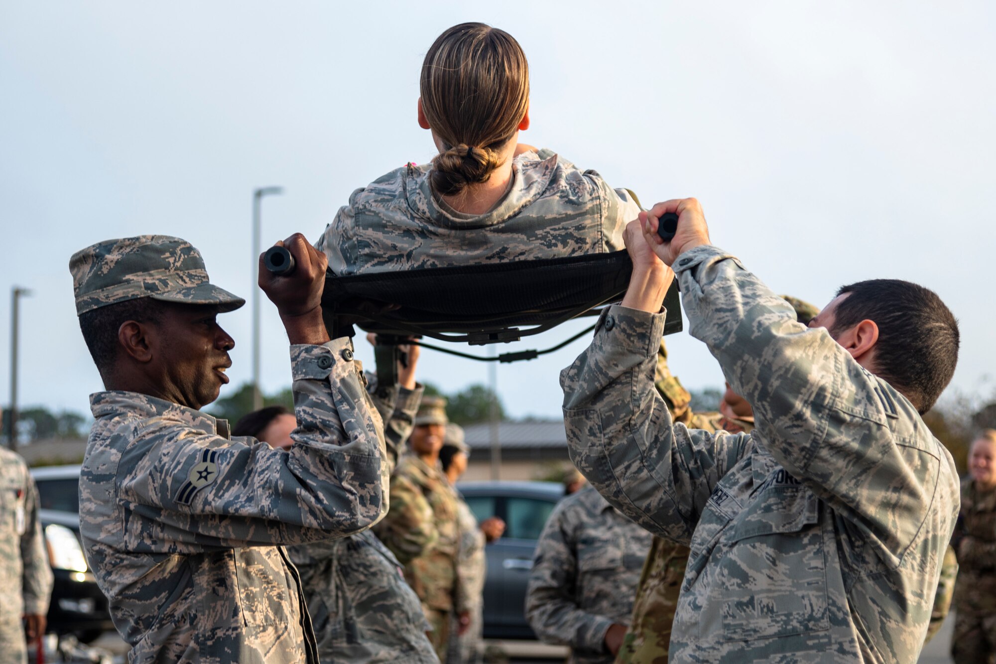 Airmen with the 23d Medical Group (MDG) practice lateral litter-carry movements during training Oct. 25, 2019, at Moody Air Force Base, Ga. The 23d MDG conducted the training in preparation for the upcoming Thunder Over South Georgia Open House. Airmen practiced litter-carry movements and commands to ensure they have the appropriate skills in the case of an emergency. (U.S. Air Force photo by Airman 1st Class Taryn Butler)