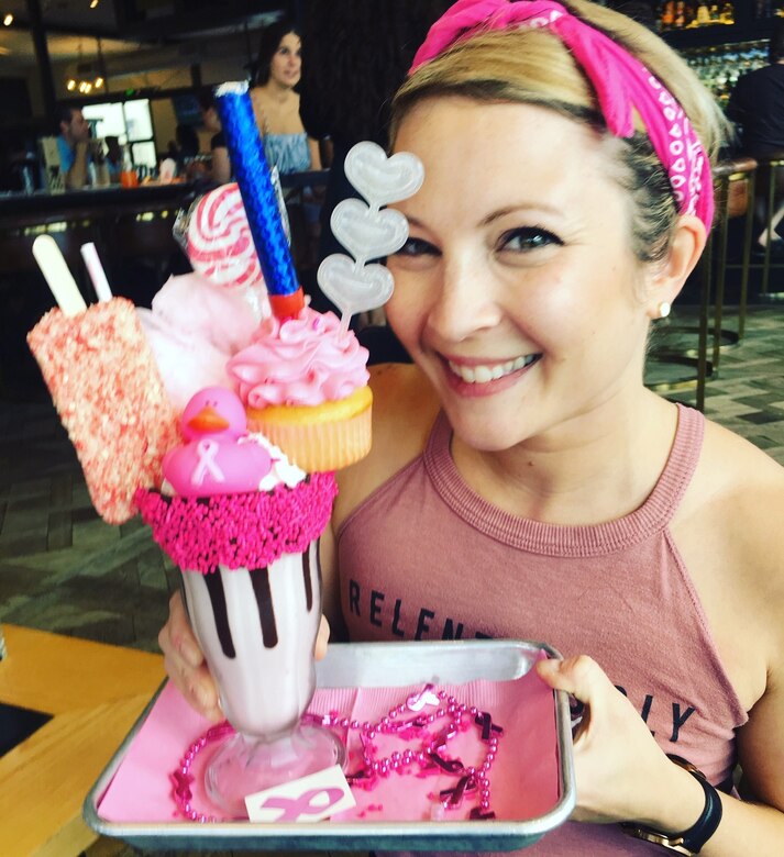 Elana Gilbert, former 14th Flying Training Wing secretary at Columbus Air Force Base, Mississippi, holds a “Freak Shake” at Hall on Franklin in Tampa, Fla. Hall on Franklin serves the “Freak Shake” during the month of October to raise money for breast cancer research. (Courtesy photo)
