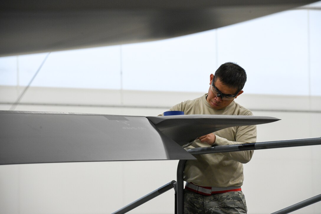 Tech. Sgt. Edmundo Pena, 388th Maintenance Squadron Fabrication Flight, performs a low observable restoration on a F-35A Lightning II wing tip at Hill Air Force Base, Utah, Oct. 3, 2019. The radar aborbent surface coatings on the F-35 help the aircraft survive in enemy air space. (U.S. Air Force photo by R. Nial Bradshaw)