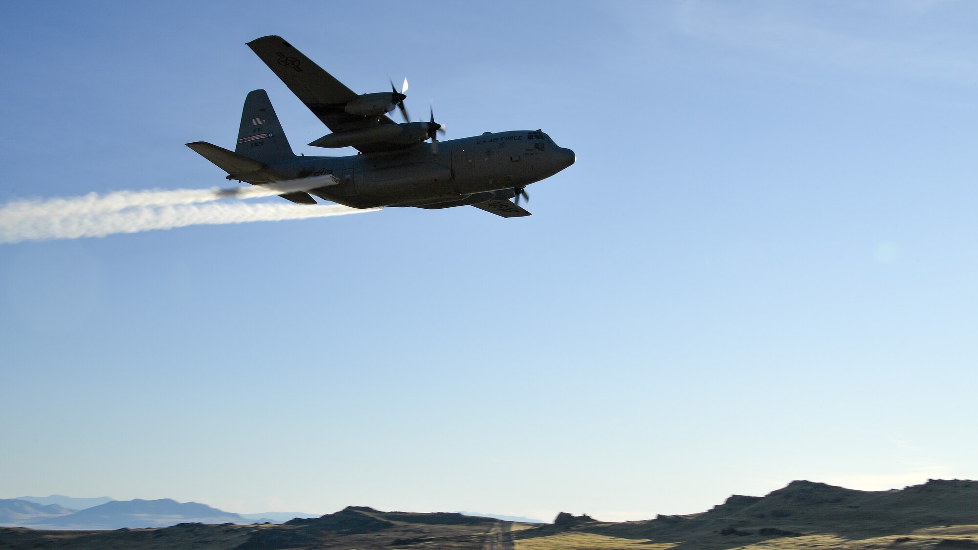 A C-130 Hercules assigned to the Air Force Reserve 757th Airlift Squadron flies over the Utah Test and Training Range Oct. 24, 2019, during an aerial spray operation.