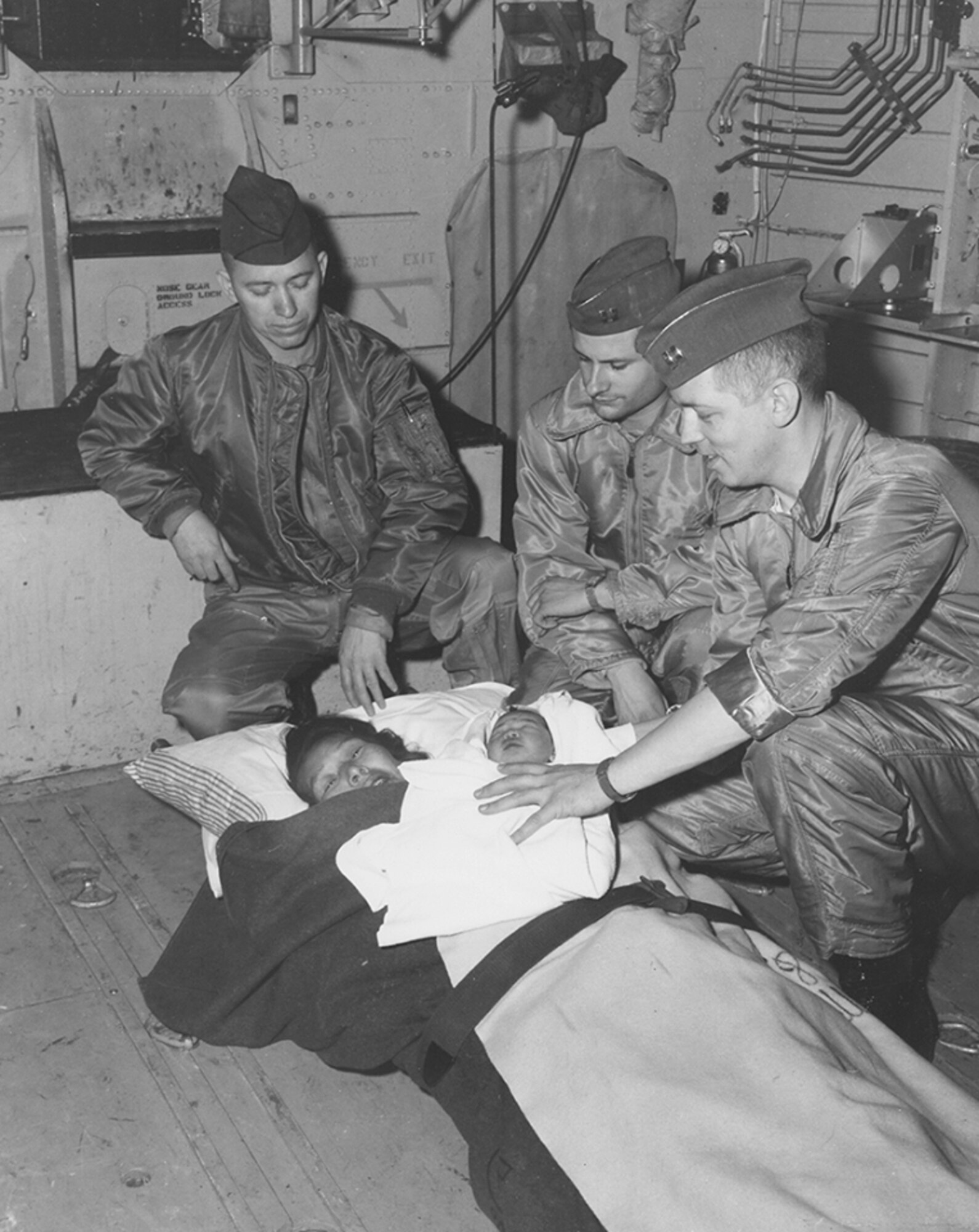 An Air Force doctor from Elmendorf Air Force Base in Anchorage, Alaska, delivered a woman’s son during a mercy flight on March 17, 1965. The C-130’s crew, from the 5017th Operations Squadron, assisted in the delivery (Courtesy photo)