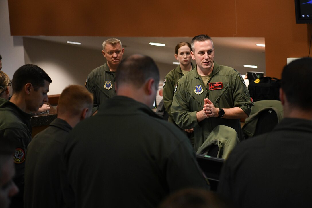 28th Bomb Wing aircrew members discuss plans before stepping to their aircraft at Ellsworth Air Force Base, S.D., Oct. 24, 2019. Several B-1s flew to the U.S. Central Command area of operations to support a Bomber Task Force. The unannounced arrival of the B-1B Lancer demonstrates the global strike capacity and ability of the U.S. Air Force and Air Force Global Strike Command to rapidly deploy forward and deliver precision-guided ordnance against any adversary. USSTRATCOM forces are on watch 24 hours a day, seven days a week to deter and detect strategic attack against the U.S. and our allies. (U.S. Air Force photo by Tech. Sgt. Jette Carr)