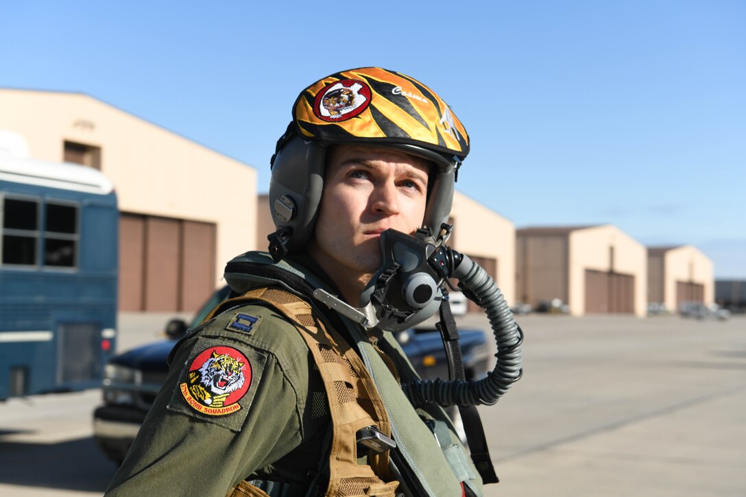 A crew member assigned to Ellsworth Air Force Base, S.D., looks off into the distance prior to boarding a B-1B Lancer scheduled to launch in support of a Bomber Task Force, Oct. 24, 2019. The B-1 can rapidly deliver massive quantities of precision and non-precision weapons against any adversary. These bomber missions are representative of the United States’ commitment to our allies and enhancing regional security. (U.S. Air Force photo by Senior Airman Nicolas Z. Erwin)