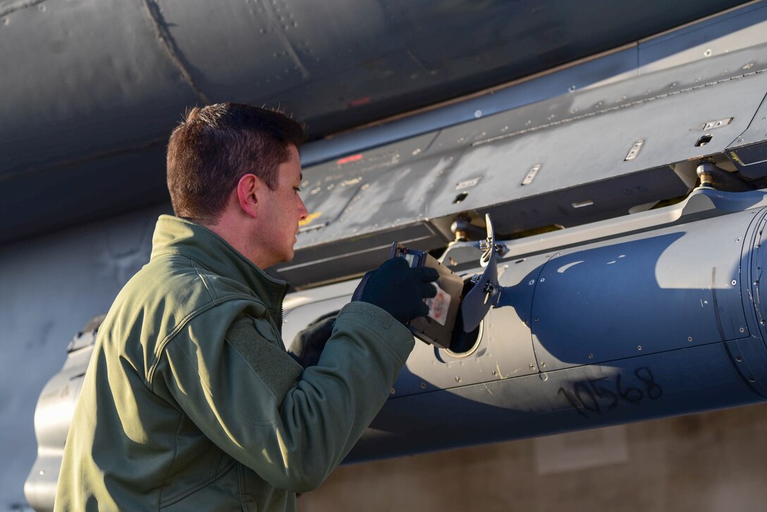 A crew member assigned to the 28th Bomb Wing, Ellsworth Air Force Base, S.D., conducts pre-flight checks prior to boarding a B-1B Lancer scheduled to fly a Bomber Task Force mission in the U.S. Central Command area of operations, Oct. 24, 2019. The B-1 can rapidly deliver massive quantities of precision and non-precision weapons against any adversary. Bomber missions demonstrate the credibility of our forces to address a globe security environment that is more diverse and uncertain than at any other time in our history. 
 (U.S. Air Force photo by Airman 1st Class John C.B. Ennis)