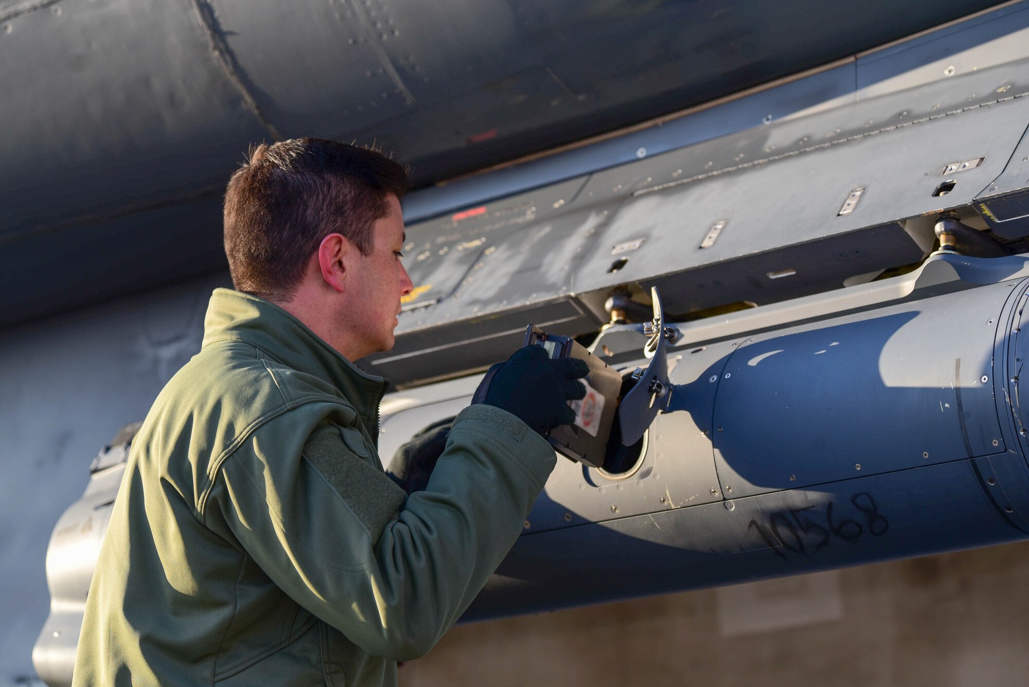 A crew member assigned to the 28th Bomb Wing, Ellsworth Air Force Base, S.D., conducts pre-flight checks prior to boarding a B-1B Lancer scheduled to fly a Bomber Task Force mission in the U.S. Central Command area of operations, Oct. 24, 2019. The B-1 can rapidly deliver massive quantities of precision and non-precision weapons against any adversary. Bomber missions demonstrate the credibility of our forces to address a globe security environment that is more diverse and uncertain than at any other time in our history. 
 (U.S. Air Force photo by Airman 1st Class John C.B. Ennis)