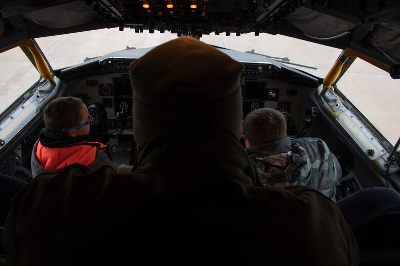 U.S. Air Force Capt. Caleb Egli, a pilot assigned to the 54th Air Refueling Squadron, explains the interworkings of the KC-135 Stratotanker to students of the STARBASE program