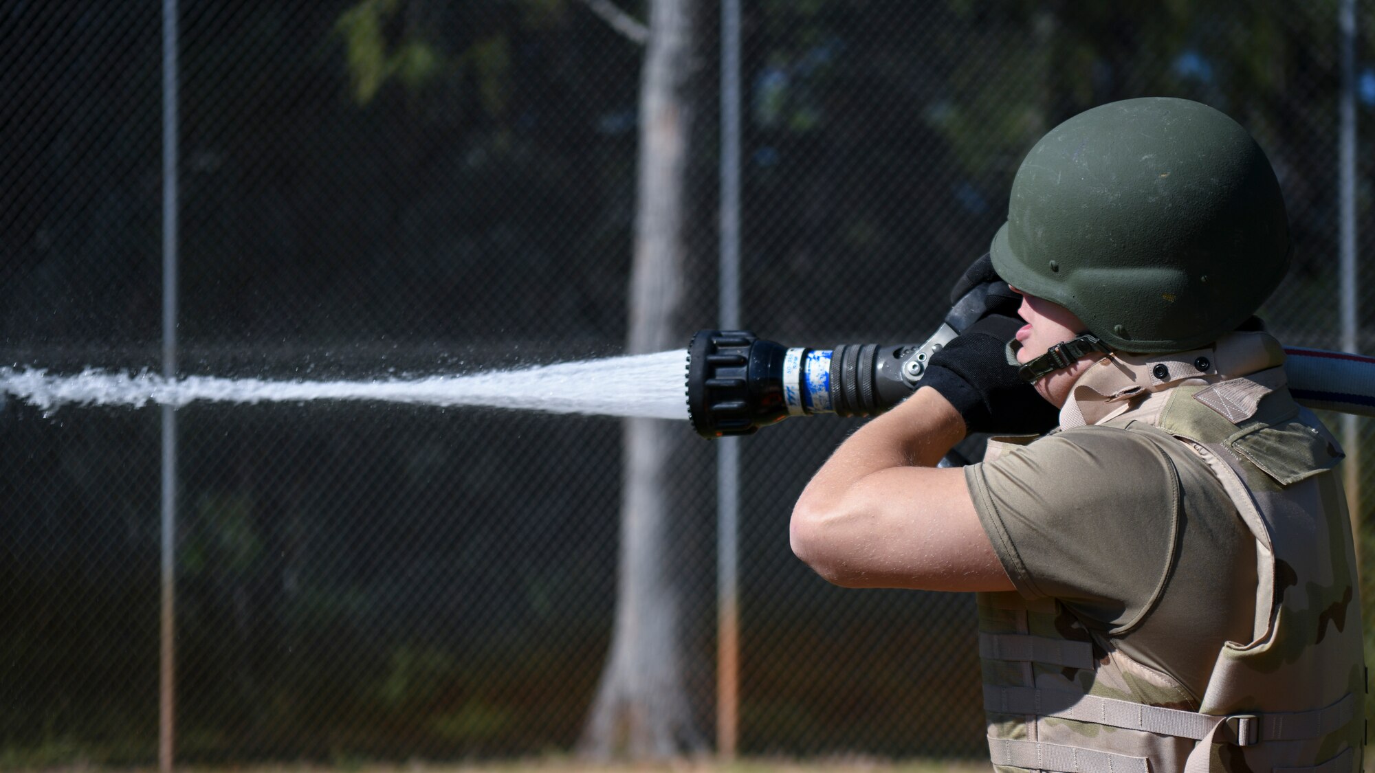 Air Commando sprays hose