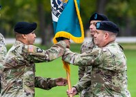 Command Sgt. Maj. Marco Torres receives the ASC colors from Maj. Gen. Steven Shapiro, commanding general of the U.S. Army Sustainment Command.