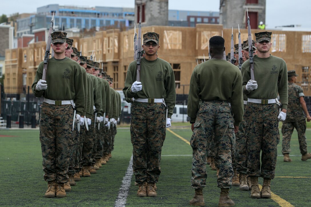 Marines with Alpha Company, Marine Barracks Washington, practice rifle manual at Marine Barracks Washington, D.C., Oct. 29, 2019. The Marines hone their rifle drill during Ceremonial Drill School. (U.S. Marine Corps photo by Sgt. Robert Knapp)
