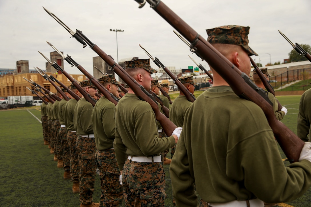 Marines with Alpha Company, Marine Barracks Washington, practice rifle manual at Marine Barracks Washington, D.C., Oct. 29, 2019. The Marines hone their rifle drill during Ceremonial Drill School. (U.S. Marine Corps photo by Lance Cpl. Allen Sanders)