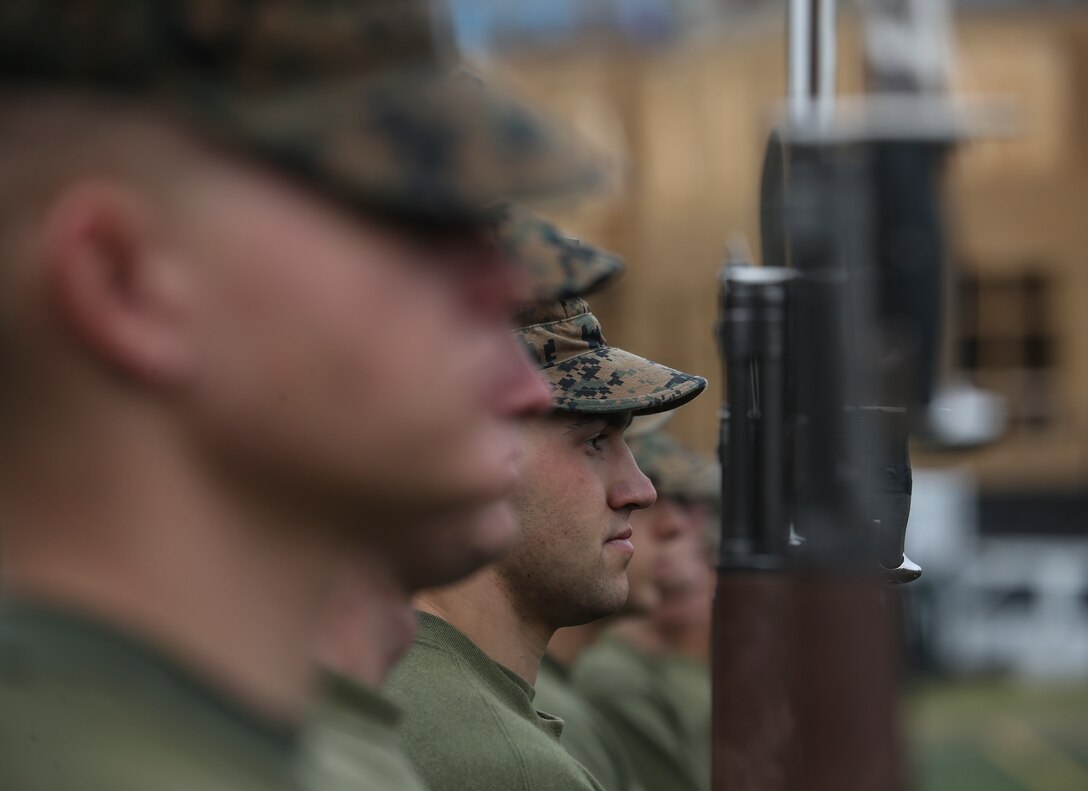 Marines with Alpha Company, Marine Barracks Washington, practice “present arms” at Marine Barracks Washington, D.C., Oct. 29, 2019. The Marines hone their rifle drill during Ceremonial Drill School. (U.S. Marine Corps photo by Sgt. Robert Knapp)