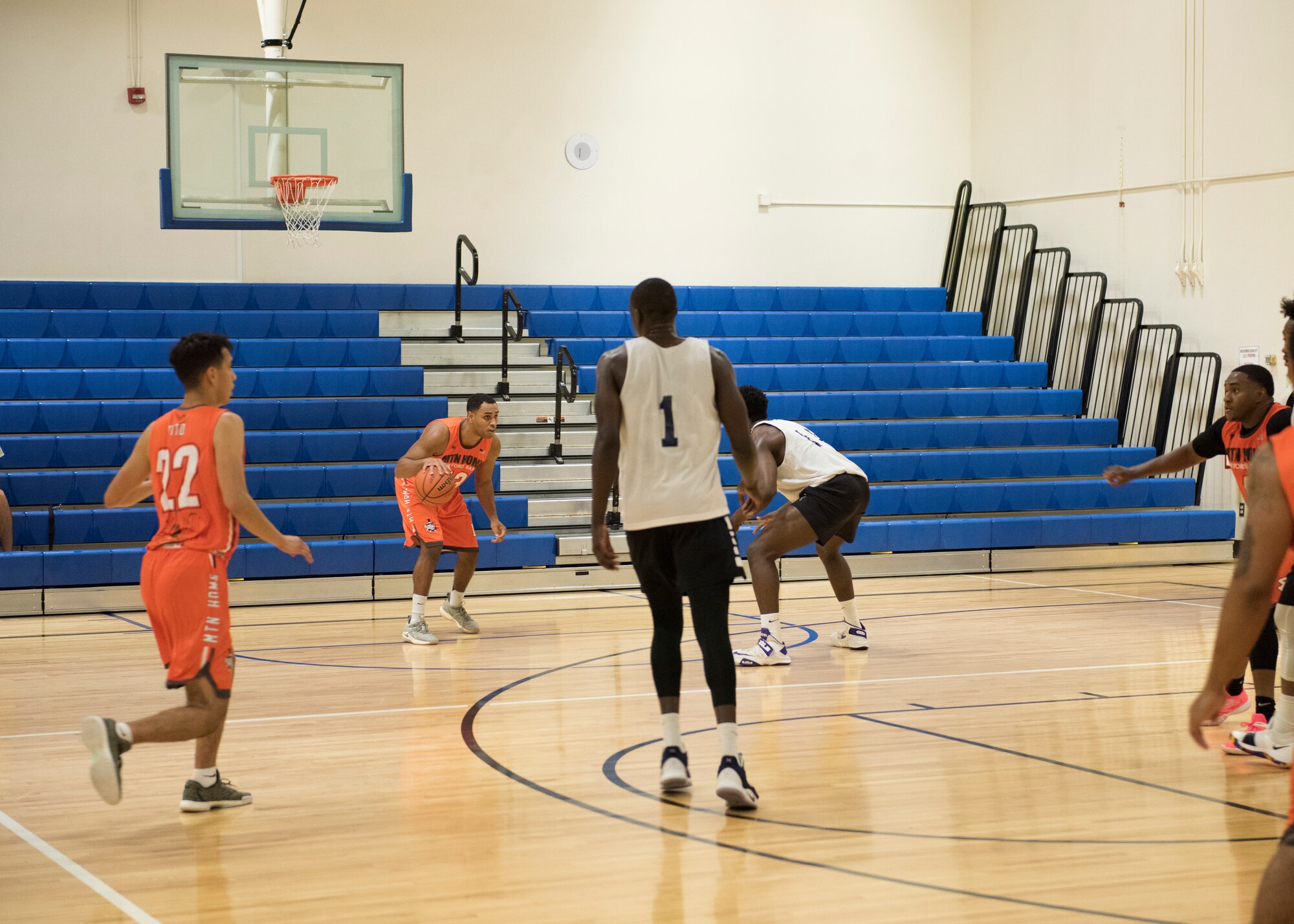 Basketball players for the Mountain Home Air Force Base Gunfighters play against a local team, Aug. 25, 2019, at Mountain Home Air Force Base, Idaho. The Gunfighters faced off with a team made of college players and players who've participated in the National Basketball Association's development league. (U.S. Air Force photo by Senior Airman Tyrell Hall)