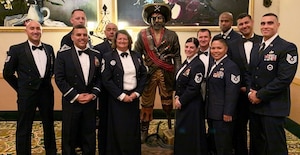 433rd TRS members pose for a photo during the Oct. 17 Military Training Instructor Association Banquet at Joint Base San Antonio-Lackland, Texas.  Pictured back row - left to right: Tech. Sgt. Nicholas Walker, Senior Master Sgt. Jason Wagner, Master Sgt. Mike Hernandez, Master Sgt. Kevin Carmony, Tech. Sgt. Davon Anderson, Master Sgt. Hugo Escobedo; Front row – left to right: 433rd TRS Commander Lt. Col. Christopher Victoria, 433rd TRS Superintendent Chief Master Sgt. Tamara Strange, Master Sgt. Nikole Rhodes, Tech. Sgt. Christina Rapolla, Tech. Sgt. Sammuel Alanis. Holding down center stage is the 433rd TRS’ beloved Raider mascot. Rapolla was named the Reserve MTI of the Year, Escobedo was the squadron’s MTIA President’s Award winner, and Alanis was the squadron’s Rookie of the Year. (U.S. Air Force photo)