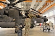 AH-64 Apache helicopter crew members assigned to Company D, 1st Battalion, 3rd Aviation Regiment (Attack Reconnaissance) conduct 500 hours phase maintenance on an AH-64 Apache helicopter at Katterbach Army Airfield, Germany, May 10, 2019. (U.S. Army photo by Charles Rosemond)