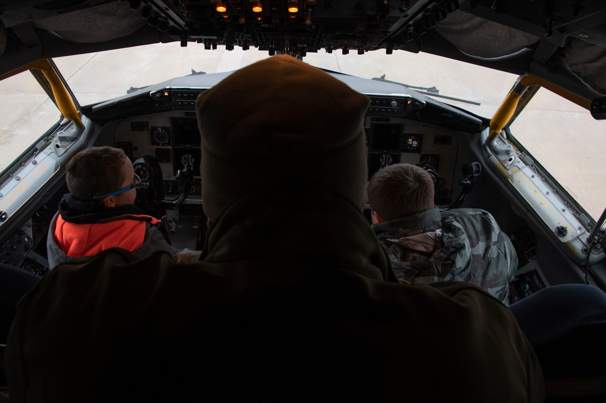 U.S. Air Force Capt. Caleb Egli, a pilot assigned to the 54th Air Refueling Squadron, explains the interworkings of the KC-135 Stratotanker to students of the STARBASE program