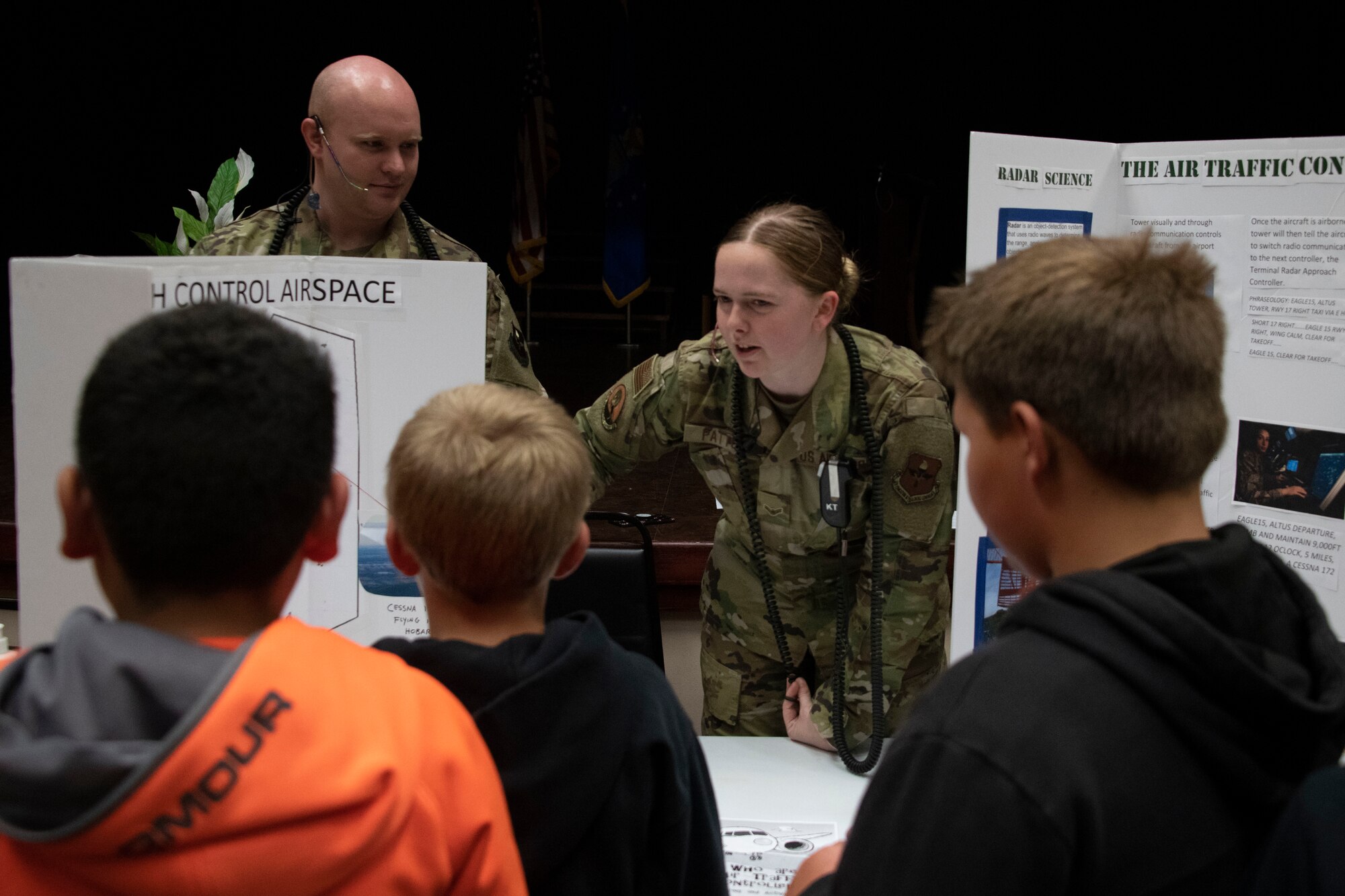 U.S. Air Force Airman 1st Class Caitlyn Patton, an Air Traffic control journeyman assigned to the 97th Operations Support Squadron, explains what they do to manage air traffic for the base to students of the STARBASE program