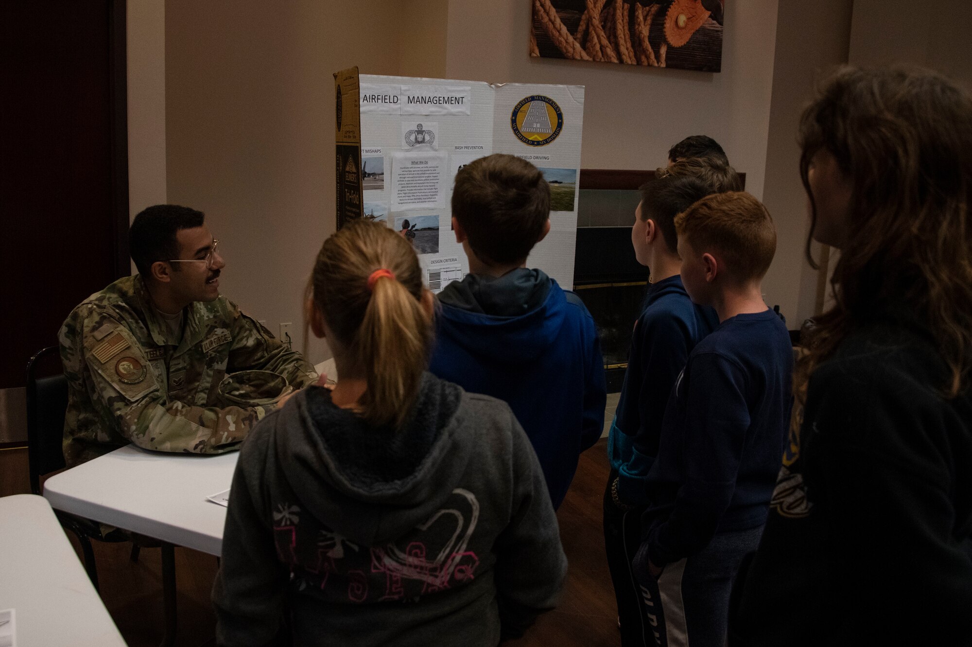 U.S. Air Force Senior Airman Steven Steele, an airfield management journeyman assigned to the 97th Operations Support Squadron, talks about their role with aircraft management to students of the STARBASE program