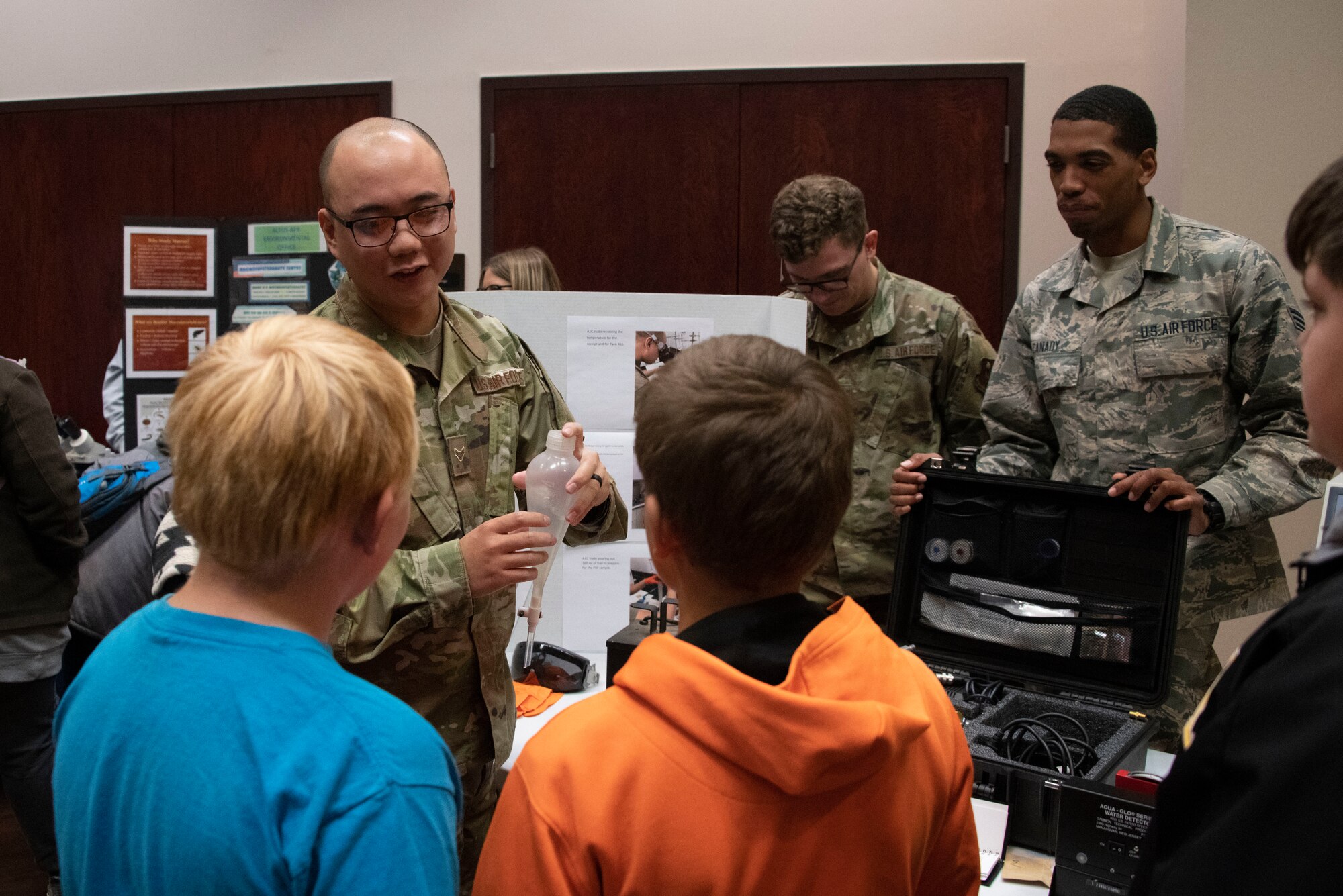 U.S. Air Force Airman 1st Class Anthony Vudo, a fuels lab technician assigned to the 97th Logistics Readiness Squadron, demonstrates what processes they perform to test fuel to students of the STARBASE program