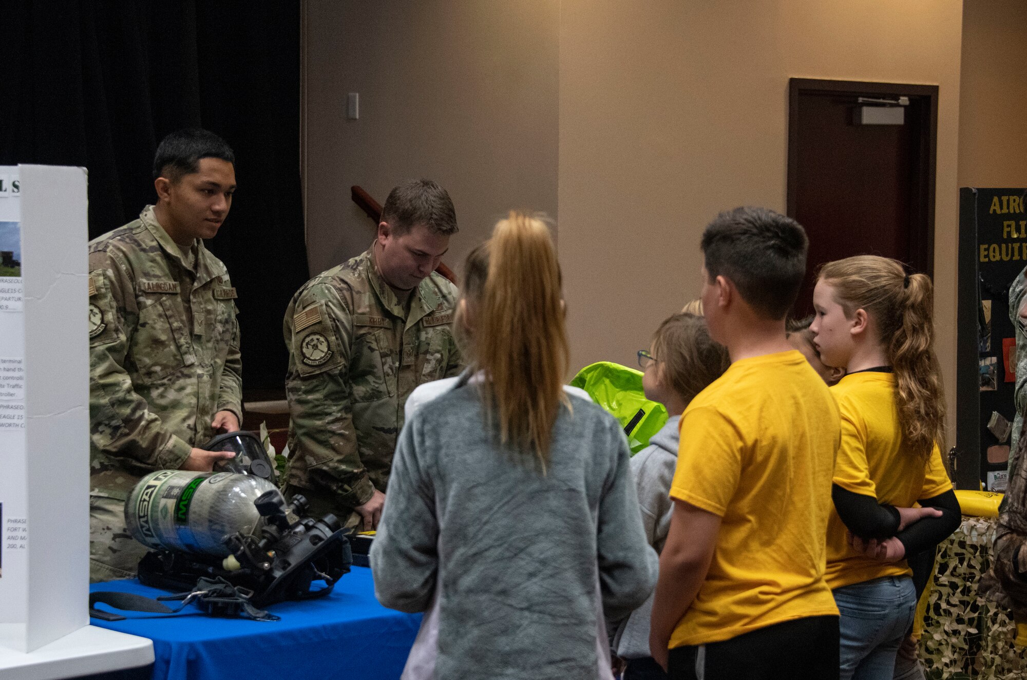 U.S. Air Force Senior Airman Jadze Talingdan, an emergency management journeyman assigned to 97th Civil Engineer Squadron, shows the emergency gear they utilize to students of the STARBASE program