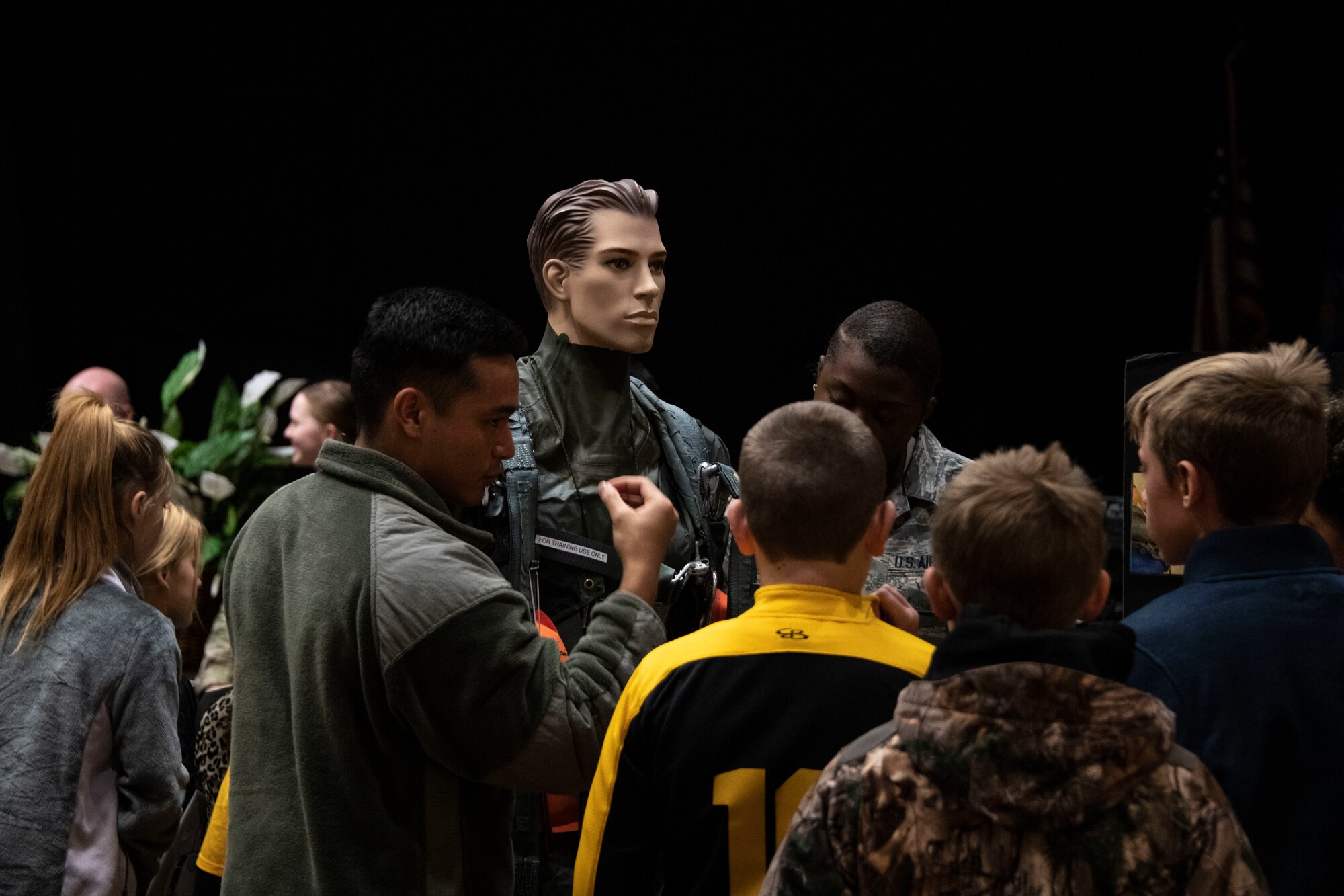 U.S. Air Force Airman 1st Class Austyn Foreman, an aircrew flight equipment journeyman assigned to 97th Operations Support Squadron, shows survival gear to students of the STARBASE program