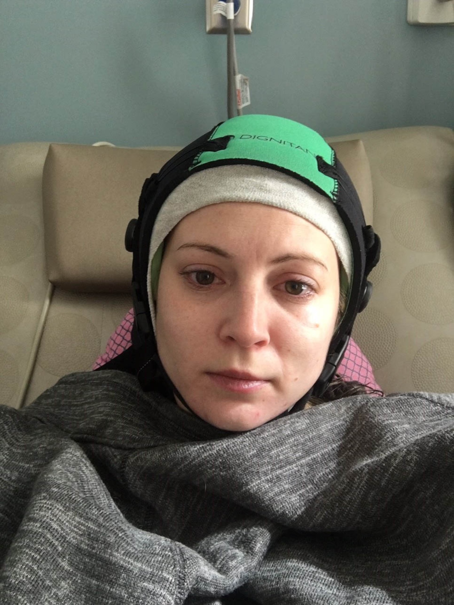 Elana Gilbert, previous 14th Flying Training Wing secretary lays in the hospital during a round of her chemotherapy. Gilbert was able to win her battle with breast cancer and has since made a full recovery. (Courtesy photo)