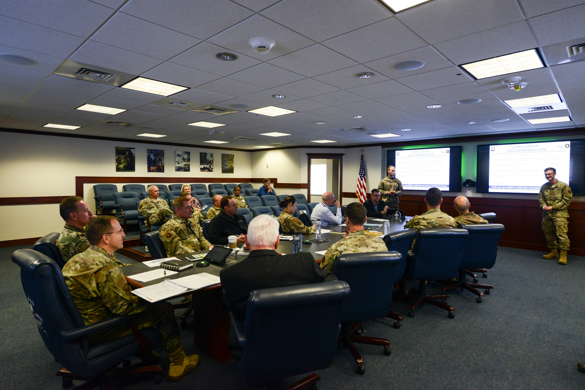A group of people observing a presentation.