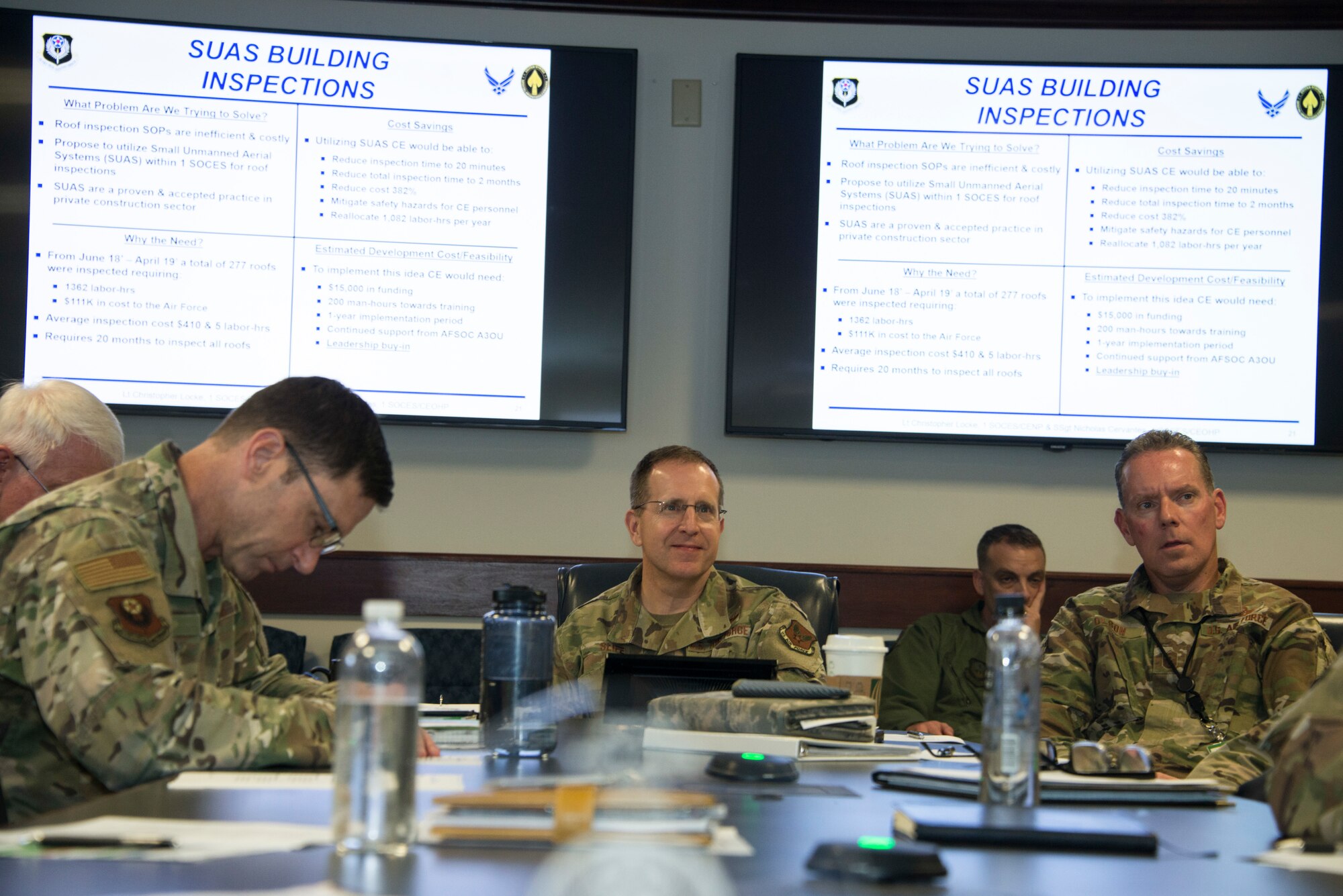 A group of people observing a presentation.