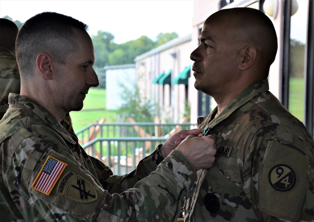 Brig. Gen. Stephen Iacovelli (left), 94th Training Division-Force Sustainment commanding general, presents Sgt. 1st Class Raul Nieves (right), 5/80th Battalion heating, ventilation, and air conditioning instructor, 3rd Ordnance Brigade, 94th TD-FS, with the Army Commendation Medal for earning top honors at the 94th TD-FS Instructor of the Year Competition Aug. 17, 2019, at Joint Base McGuire-Dix-Lakehurst, New Jersey.

As the overall competition winner, Nieves was also presented with a trophy, offered a slot to attend the Army Air Assault School, and will automatically advance to compete in the upcoming 80th Training Command IOY Competition Oct. 23-27, 2019. (Photo by Sgt. 1st Class Emily Anderson, 94th TD-FS Public Affairs Office)