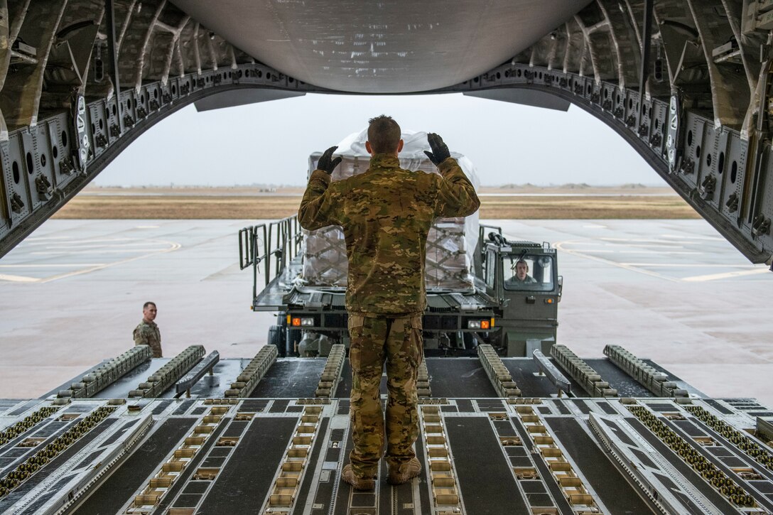 Rice and soy meals are flown to Honduras on a C-17.