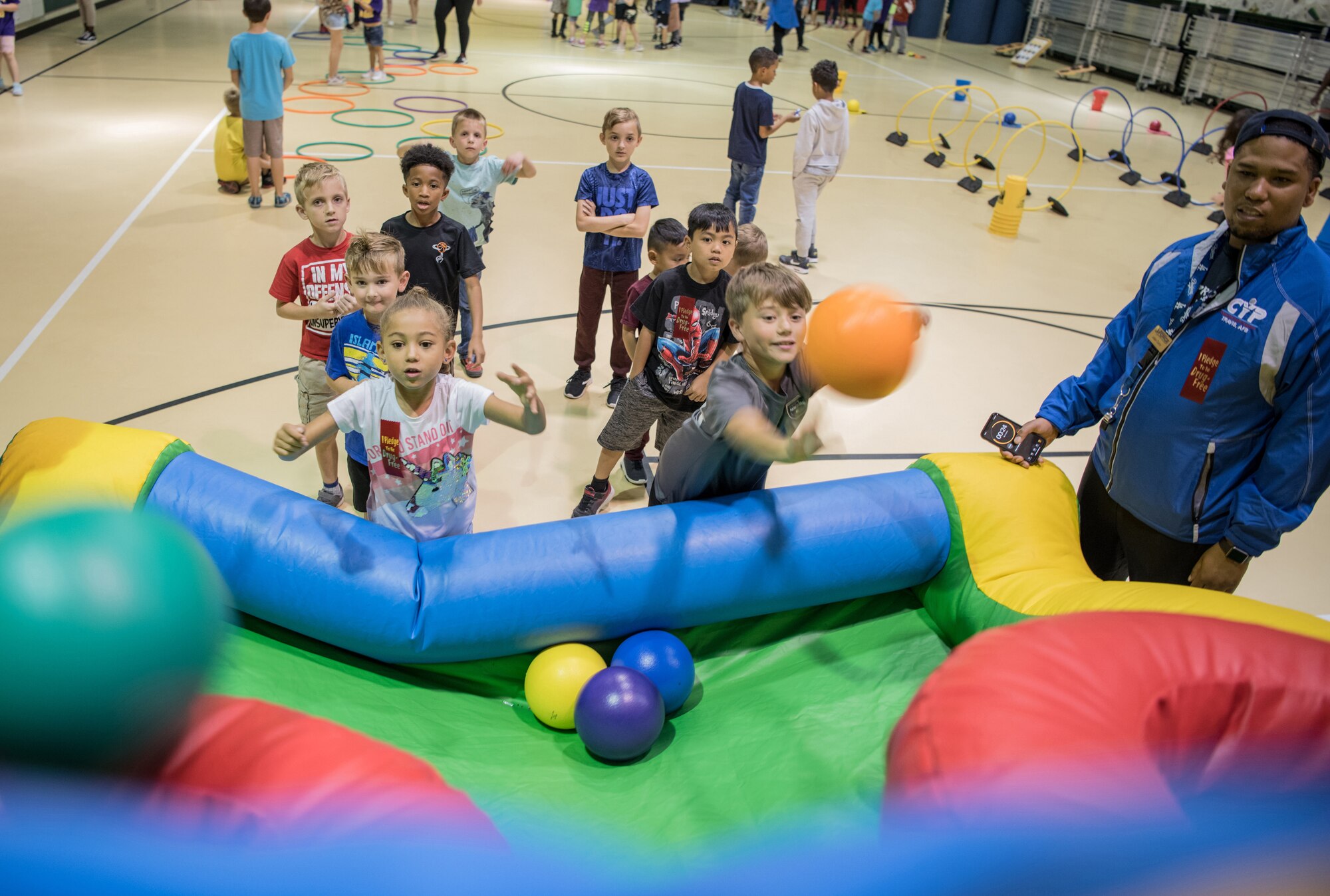 Harper Williams, 6, and Mathias Marquez, 8, compete in a basketball game as Julian Curry, 60th Force Support Squadron child and youth assistant keeps score at the Youth Center during Red Ribbon Week Oct. 23, 2019, at Travis Air Force Base, California. Red Ribbon Week is a drug prevention, awareness and educational program in conjunction with the Drug Demand Reduction Program within the Department of Defense. (U.S. Air Force Photo by Nicholas Pilch)