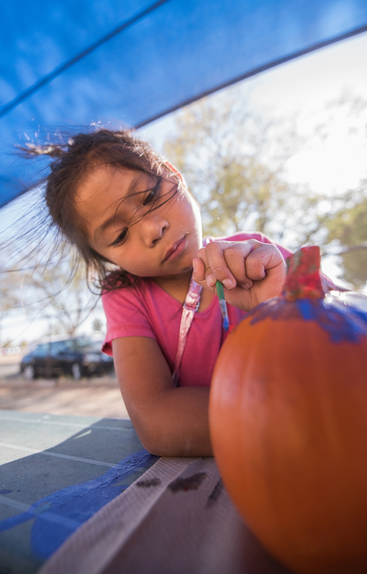 Kaily Landero, 6, paints a pumpkin at the Youth Center during Red Ribbon Week Oct. 23, 2019, at Travis Air Force Base, California. Red Ribbon Week is a drug prevention, awareness and educational program in conjunction with the Drug Demand Reduction Program within the Department of Defense. (U.S. Air Force Photo by Nicholas Pilch)