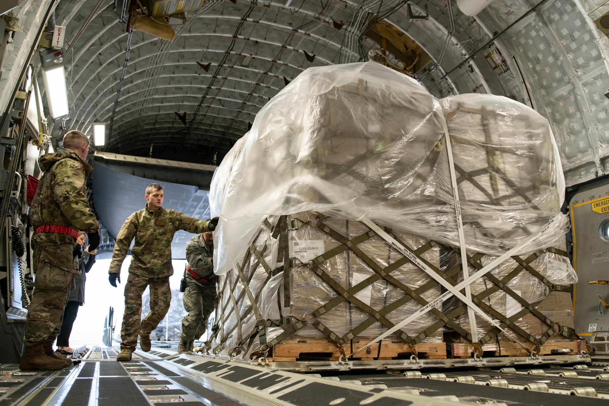 Rice and soy meals are flown to Honduras on a C-17.