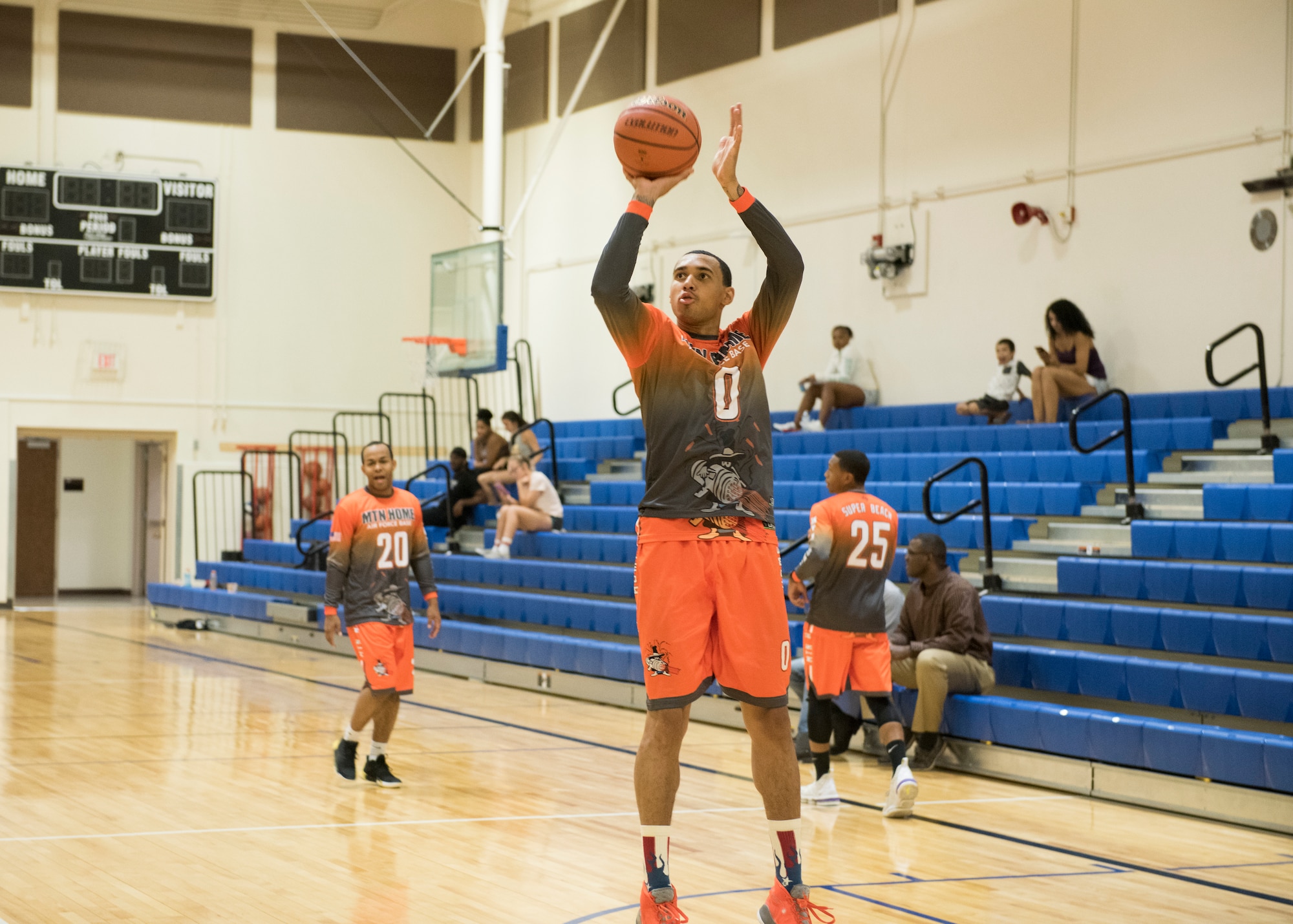 Senior Airman Arien Foster, 366th Equipment Maintenance Squadron aircraft structural maintenance journeyman, shoots a basketball during a warm up at a basketball game, Aug. 25, 2019, at Mountain Home Air Force Base, Idaho. The Gunfighters faced off with a team made of college players and players who've participated in the National Basketball Association's development league. (U.S. Air Force photo by Senior Airman Tyrell Hall)