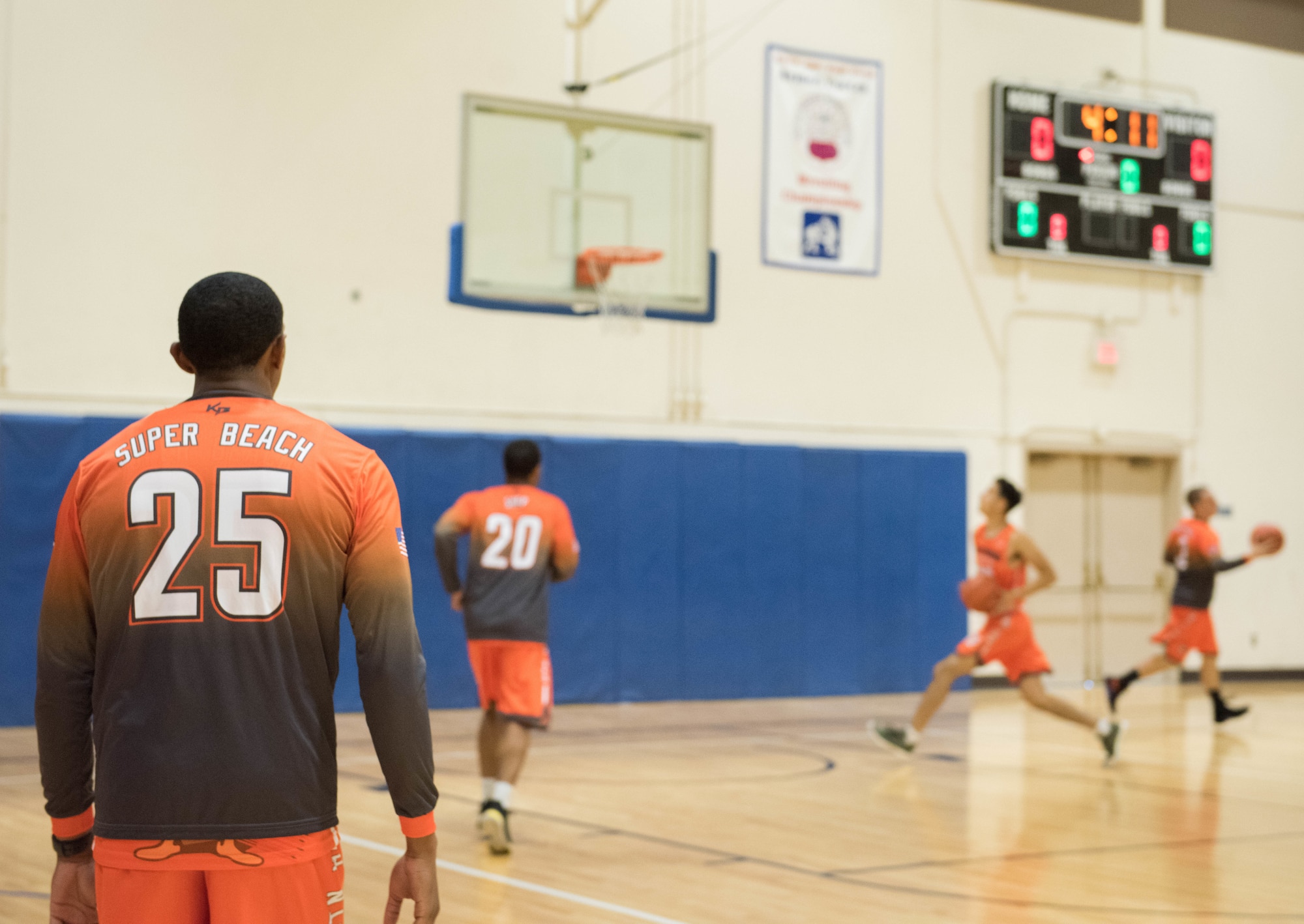 Airman 1st Class Alex Beachum, 366th Logistics Readiness Squadron vehicle operator, participates in a warm up before a basketball game, Aug. 25, 2019, at Mountain Home Air Force Base, Idaho. The Gunfighters faced off with a team made of college players and players who've participated in the National Basketball Association's development league. (U.S. Air Force photo by Senior Airman Tyrell Hall)