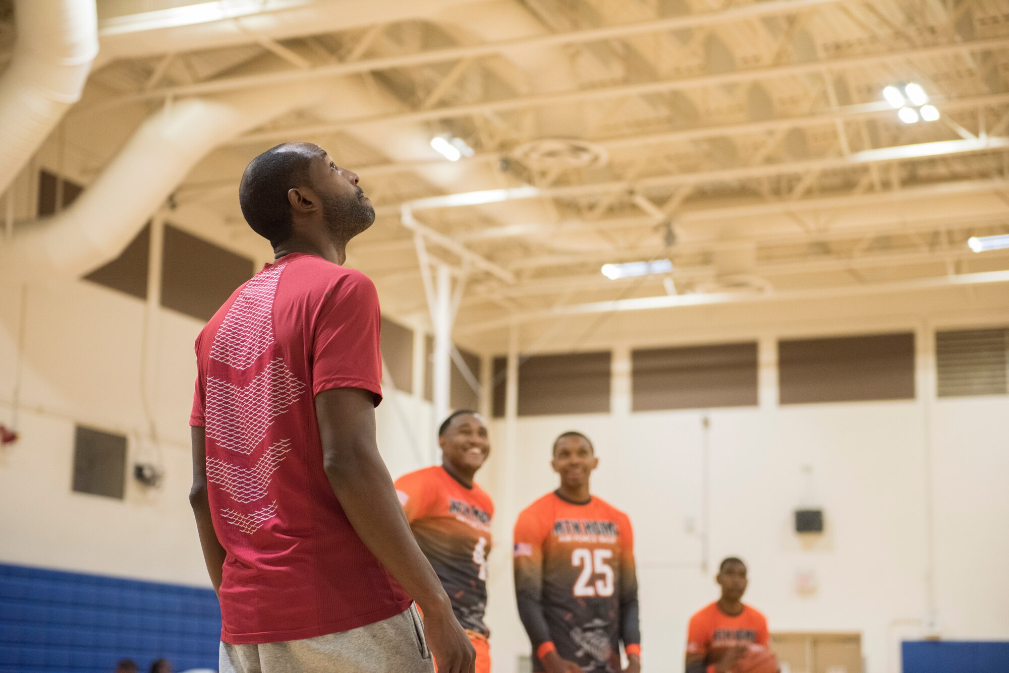 Airman 1st Class Brandon Taylor, 366th Maintenance Squadron aerospace ground equipment range, supervises a basketball team while they practice at a game, Aug. 25, 2019, at Mountain Home Air Force Base, Idaho. Taylor coached the Gunfighters during a game where they faced off with a team made of college players and players who've participated in the National Basketball Association's development league. (U.S. Air Force photo by Senior Airman Tyrell Hall)