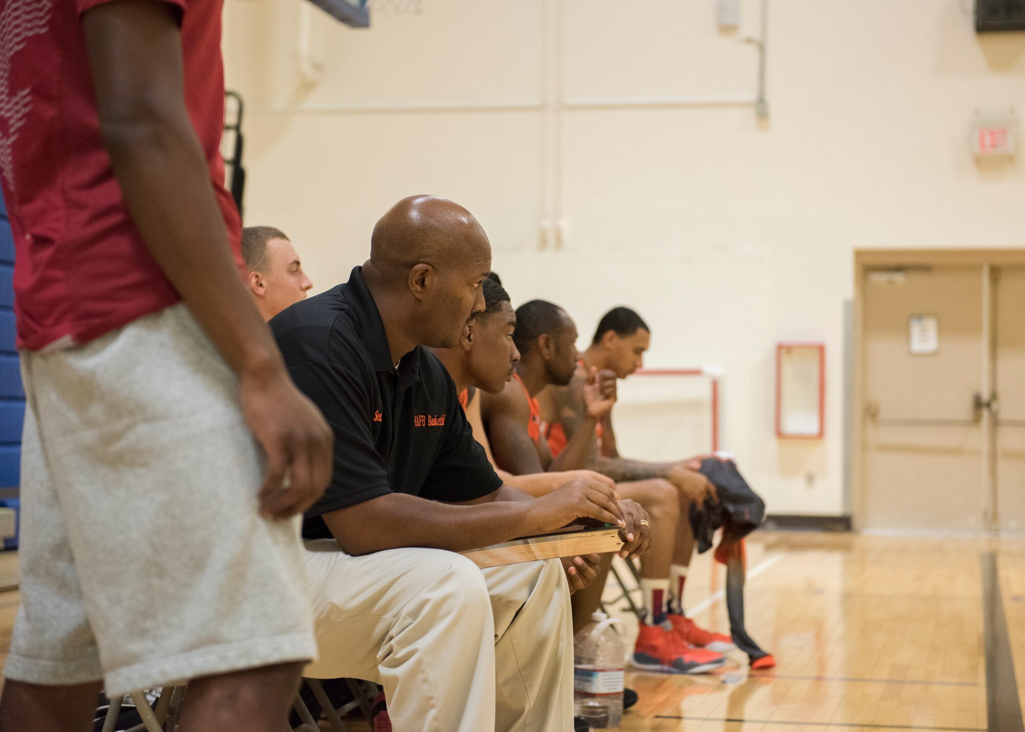 Tech. Sgt. Sean Collin, 726th Air Control Squadron NCOIC of weapons and tactics, supervises a team during a basketball game, Aug. 25, 2019, at Mountain Home Air Force Base, Idaho. The Gunfighters faced off with a team made of college players and players who've participated in the National Basketball Association's development league. (U.S. Air Force photo by Senior Airman Tyrell Hall)