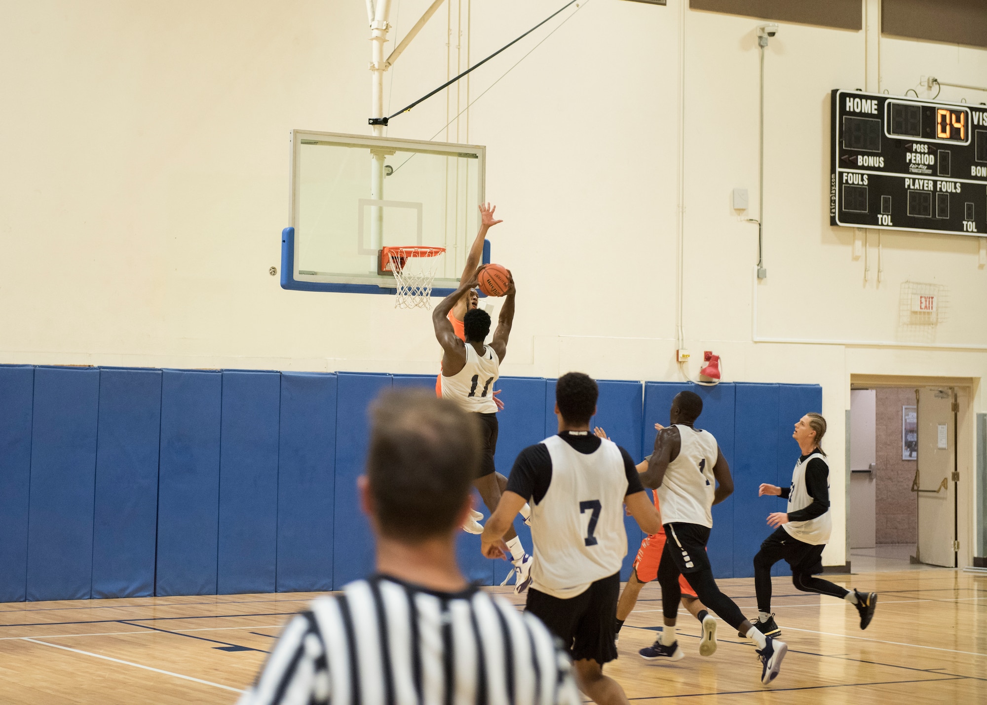 Basketball players for the Mountain Home Air Force Base Gunfighters play against a local team, Aug. 25, 2019, at Mountain Home Air Force Base, Idaho. The Gunfighters faced off with a team made of college players and players who've participated in the National Basketball Association's development league. (U.S. Air Force photo by Senior Airman Tyrell Hall)