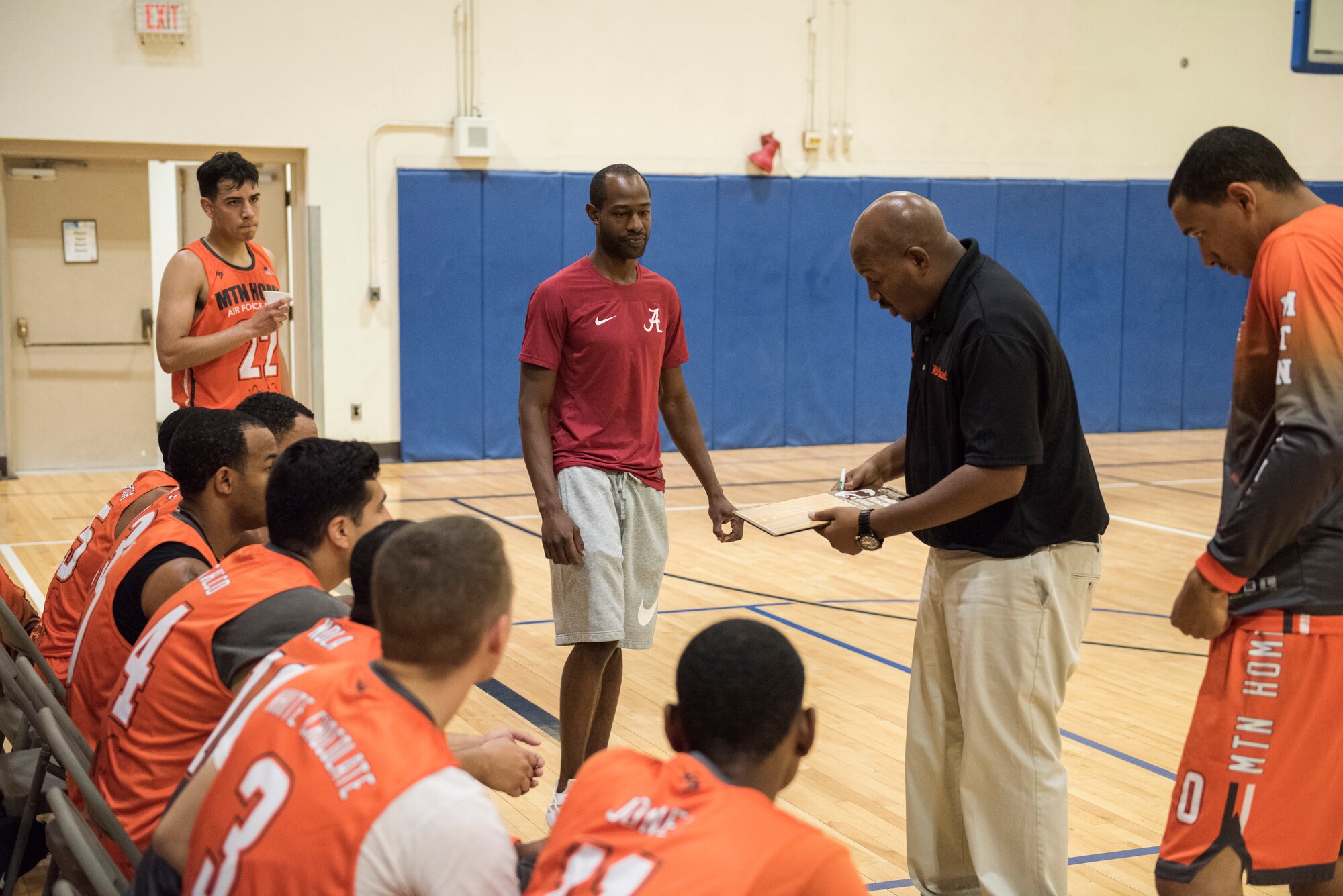 Tech. Sgt. Sean Collin, 726th Air Control Squadron NCOIC of weapons and tactics, instructs The Gunfighters during a basketball game, Aug. 25, 2019, at Mountain Home Air Force Base, Idaho. The Gunfighters faced off with a team made of college players and players who've participated in the National Basketball Association's development league. (U.S. Air Force photo by Senior Airman Tyrell Hall)