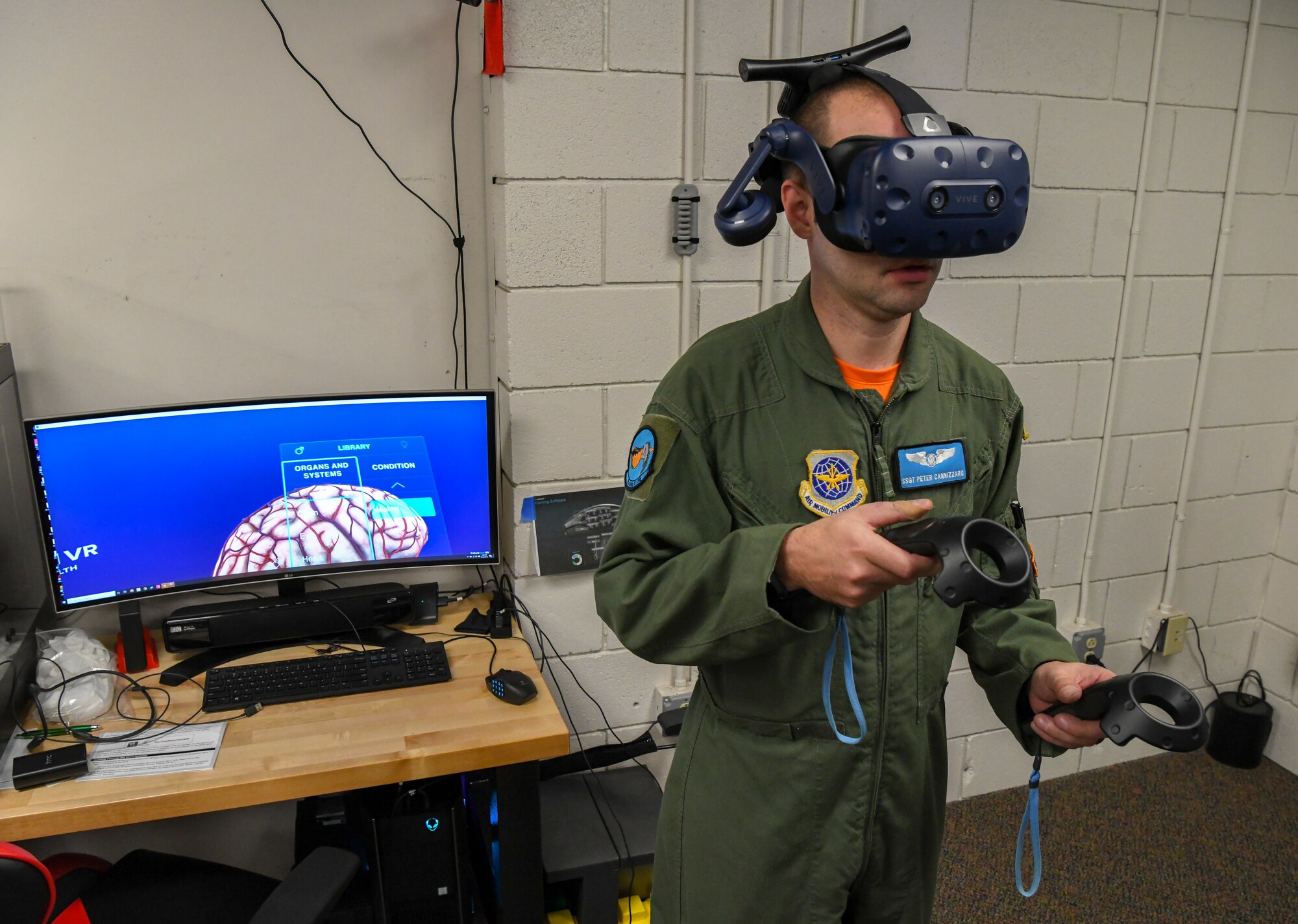 Staff. Sgt. Peter Cannizzaro, 9th Airlift Squadron loadmaster, uses a virtual reality headset to work on a brain as a demonstration of what you can do with VR Oct. 25, 2019 at Dover Air Force Base, Del. Working on a brain is one of many options Bedrock is looking into for VR educational training. (U.S. Air Force photo by Senior Airman Christopher Quail)