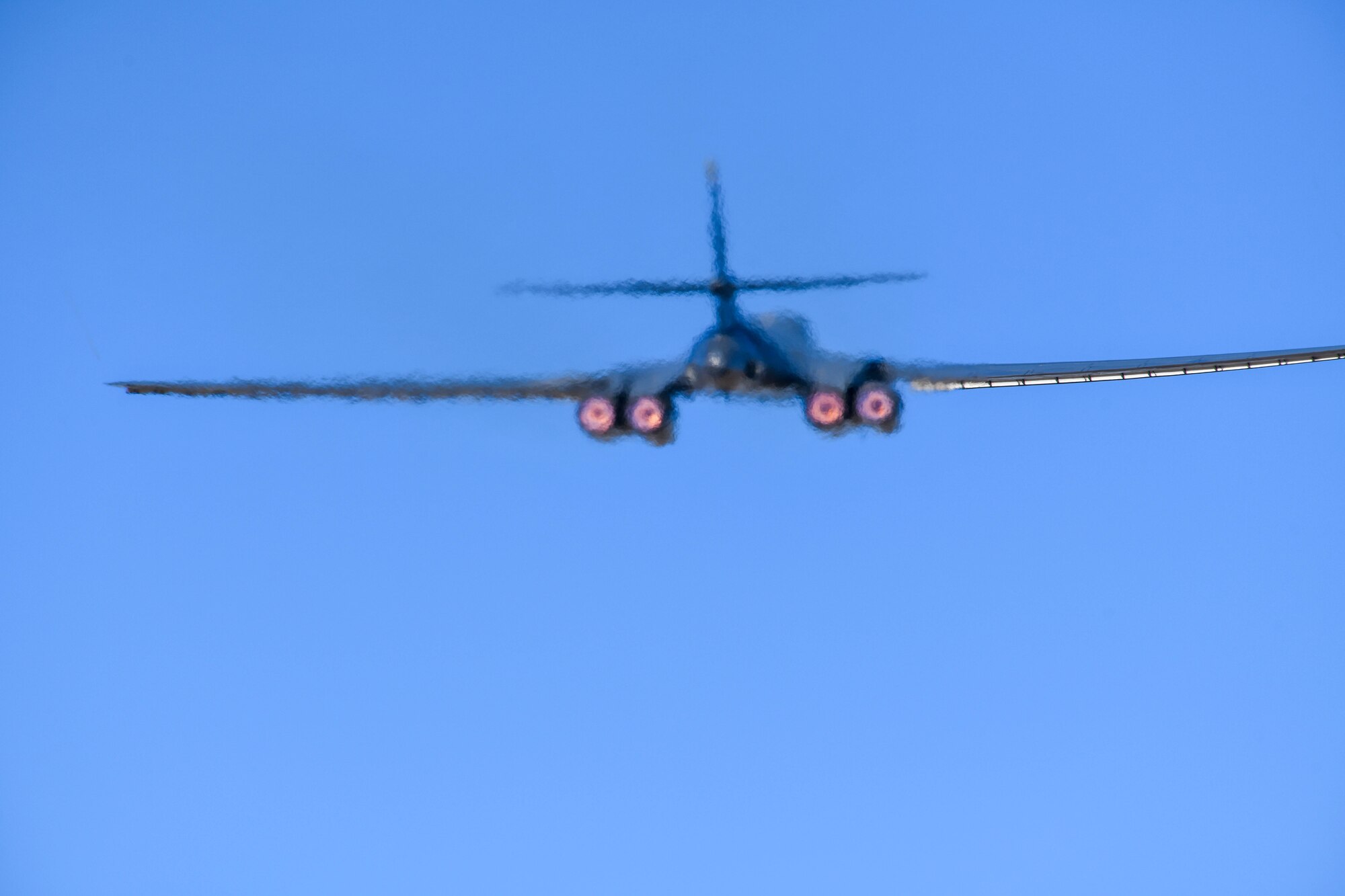 The afterburners of a B-1B Lancer glow as the bomber takes off from Ellsworth Air Force Base, S.D., Oct. 24, 2019. The deployment of this aircraft allows militaries from the United States and regional partner nations to train and work together to strengthen military-to-military relationships, promote regional security, improve combined tactical air operations and enhance interoperability of forces. The U.S. routinely and visibly demonstrates to our allies and partners through the global employment of our military forces. (U.S. Air Force photo by Staff Sgt. Hailey Staker)
